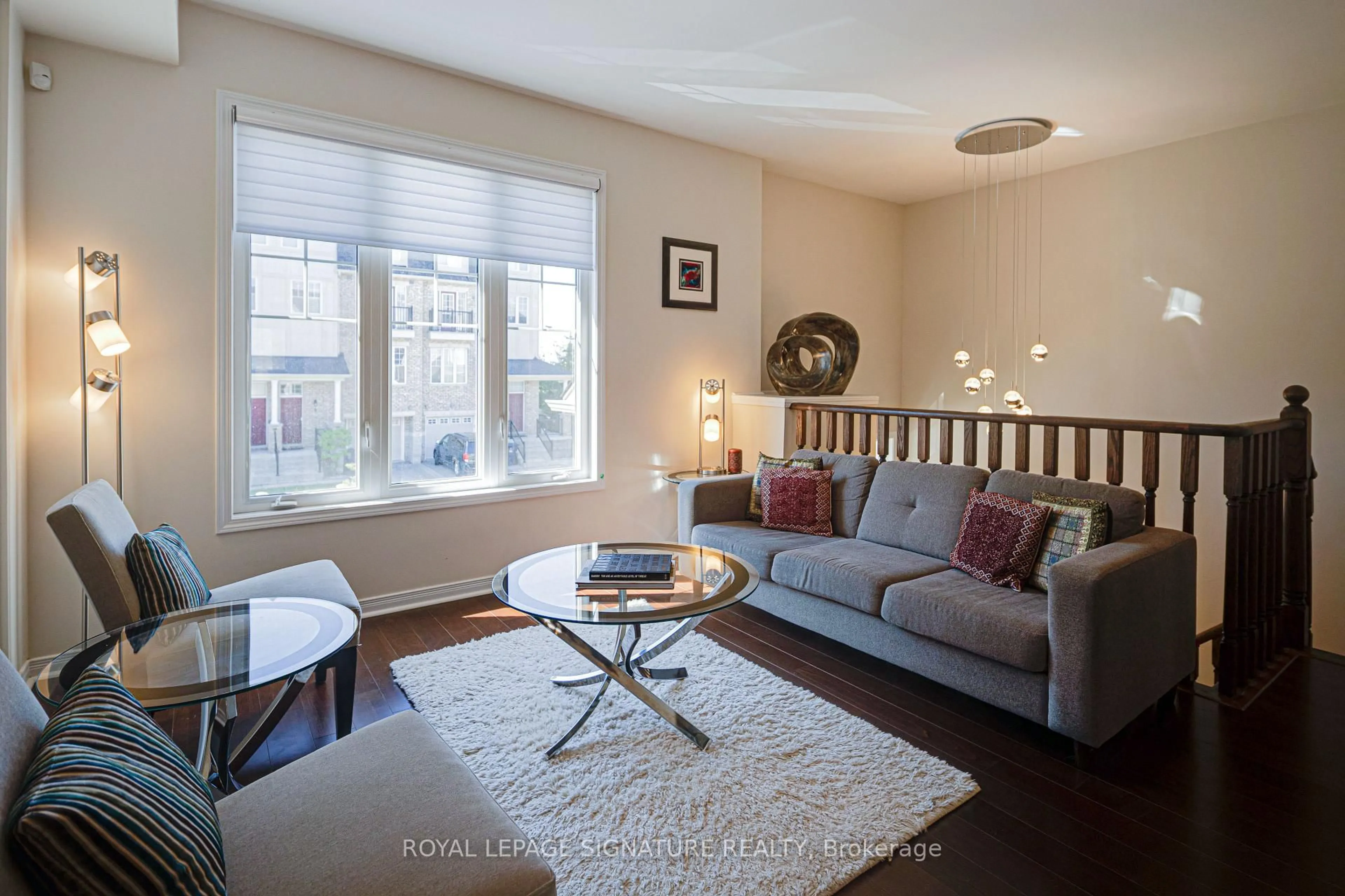 Living room with furniture, wood/laminate floor for 6 Collip Pl, Toronto Ontario M4A 1Y3