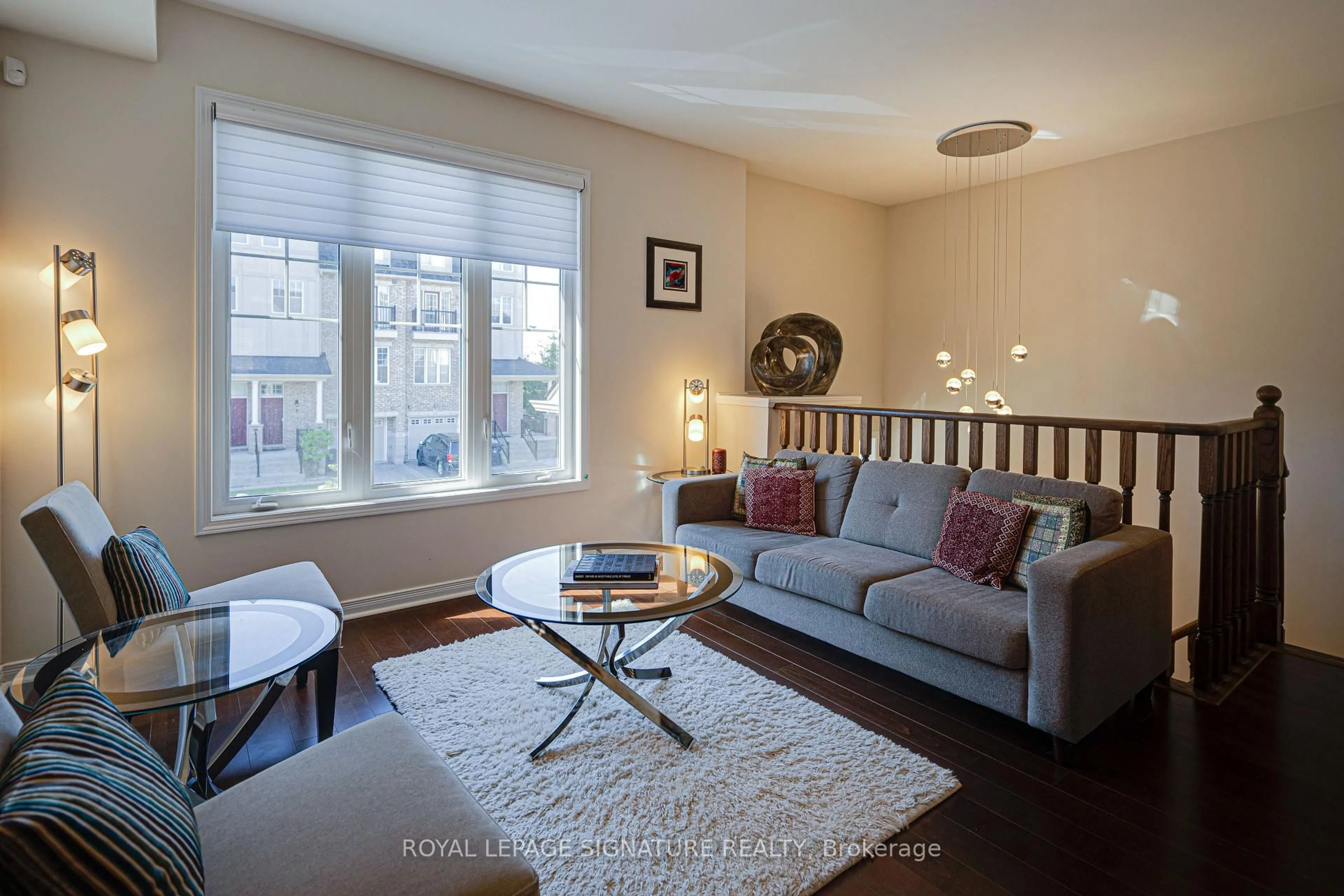 Living room with furniture, wood/laminate floor for 6 Collip Pl, Toronto Ontario M4A 1Y3