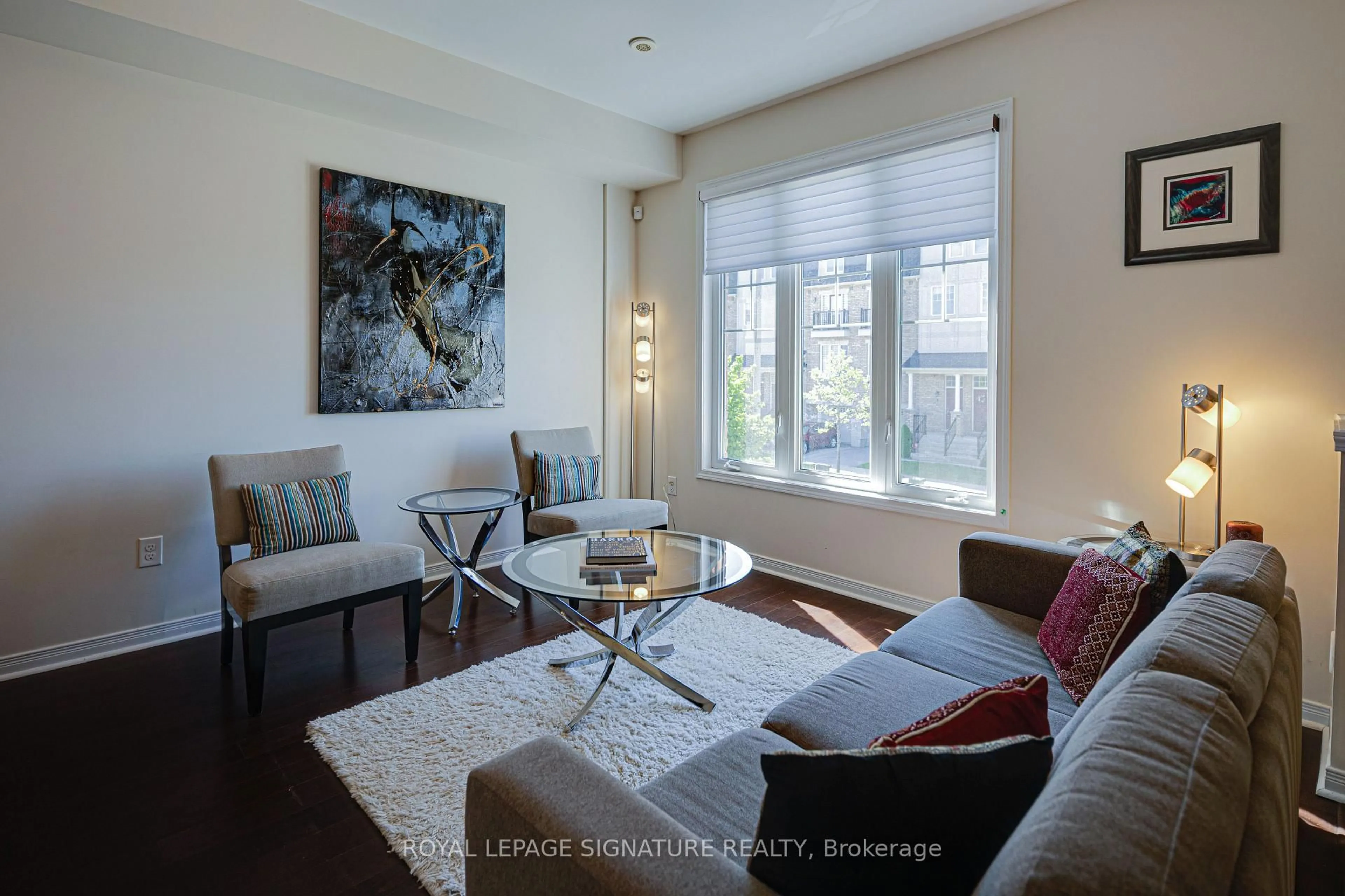 Living room with furniture, wood/laminate floor for 6 Collip Pl, Toronto Ontario M4A 1Y3
