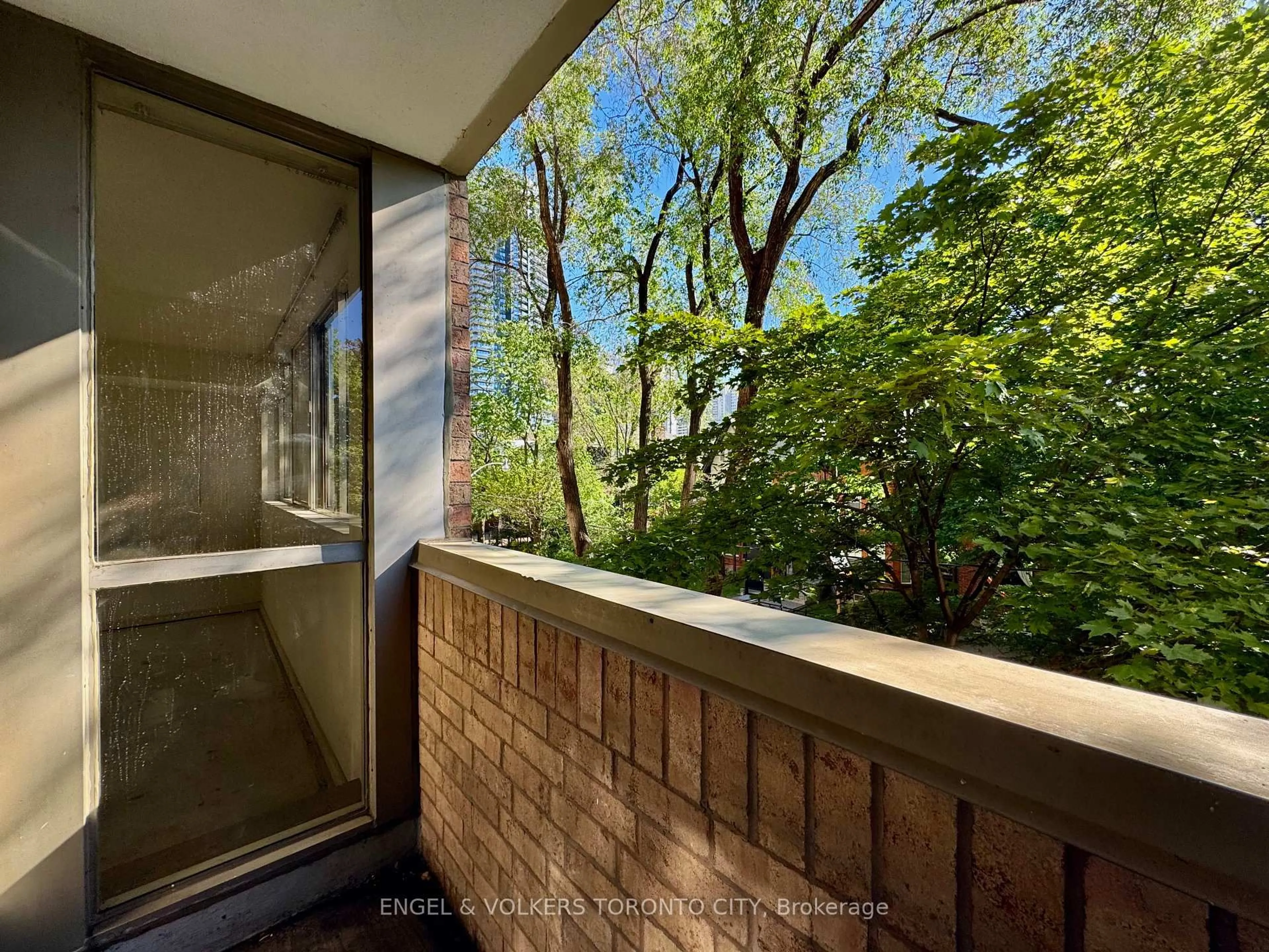 Balcony in the apartment, forest/trees view for 60 Homewood Ave #325, Toronto Ontario M4Y 2X4
