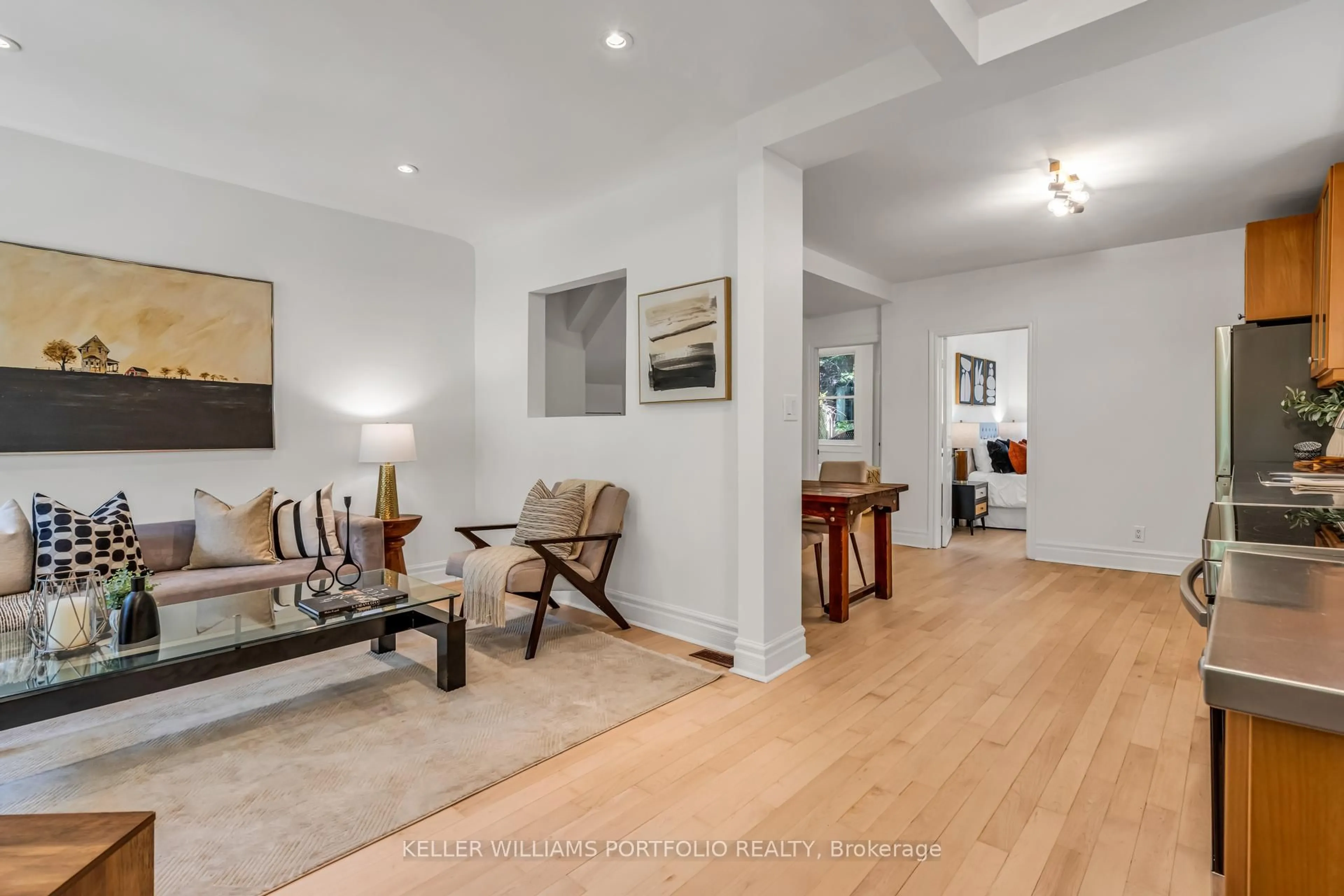 Living room with furniture, wood/laminate floor for 79 Gore Vale Ave, Toronto Ontario M6J 2R5