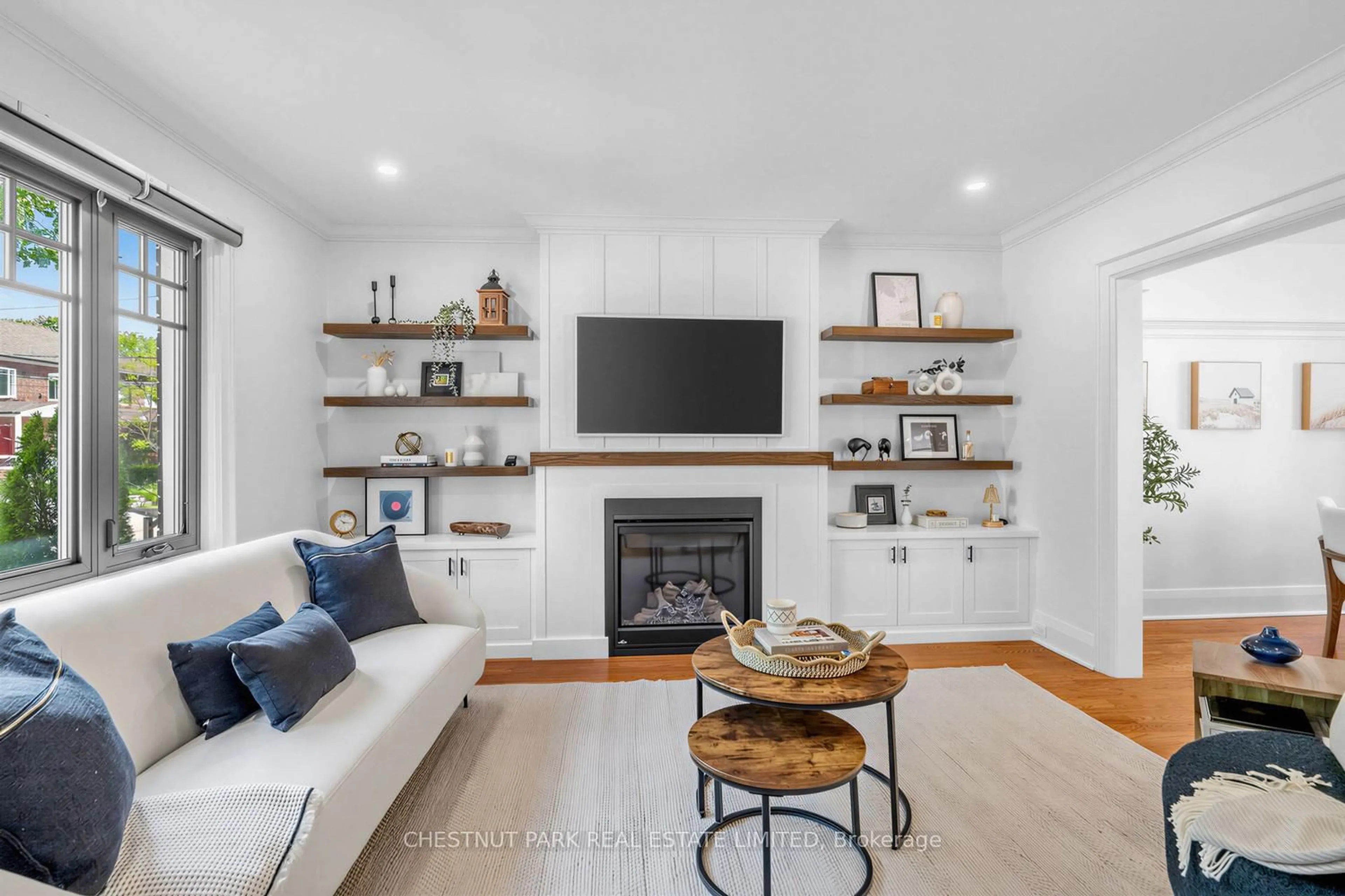 Living room with furniture, wood/laminate floor for 29 Elvina Gdns, Toronto Ontario M4P 1X7