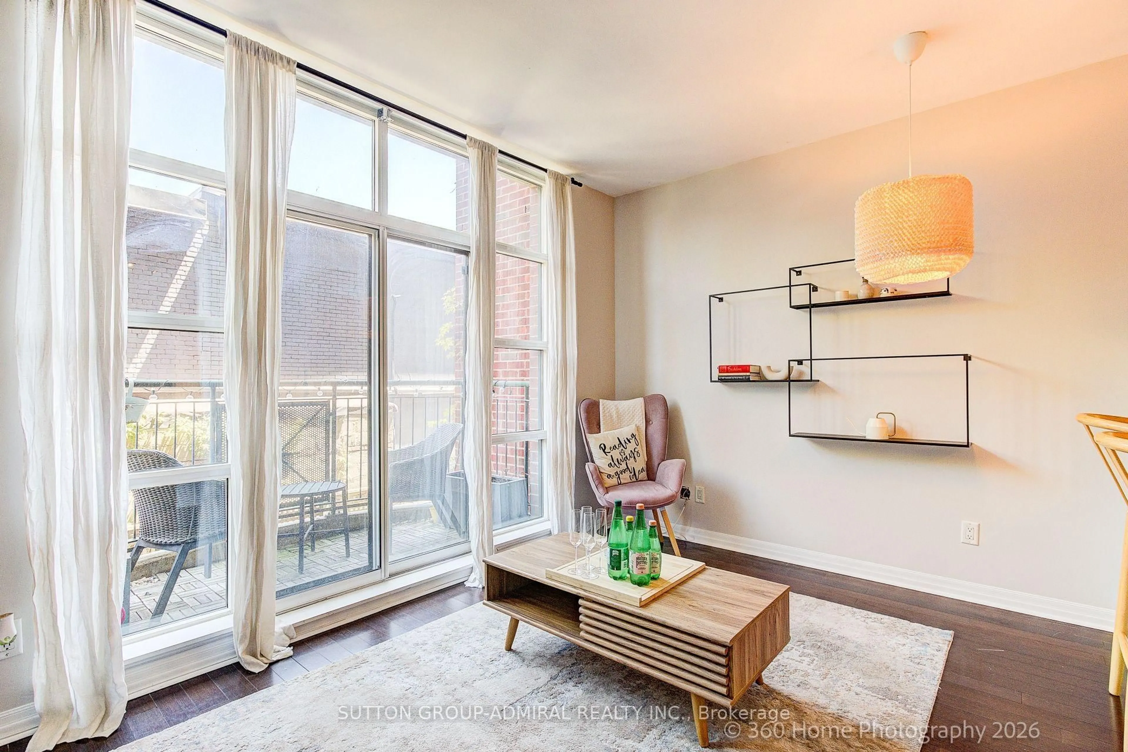 Living room with furniture, wood/laminate floor for 901 Queen St #208, Toronto Ontario M6J 3X4