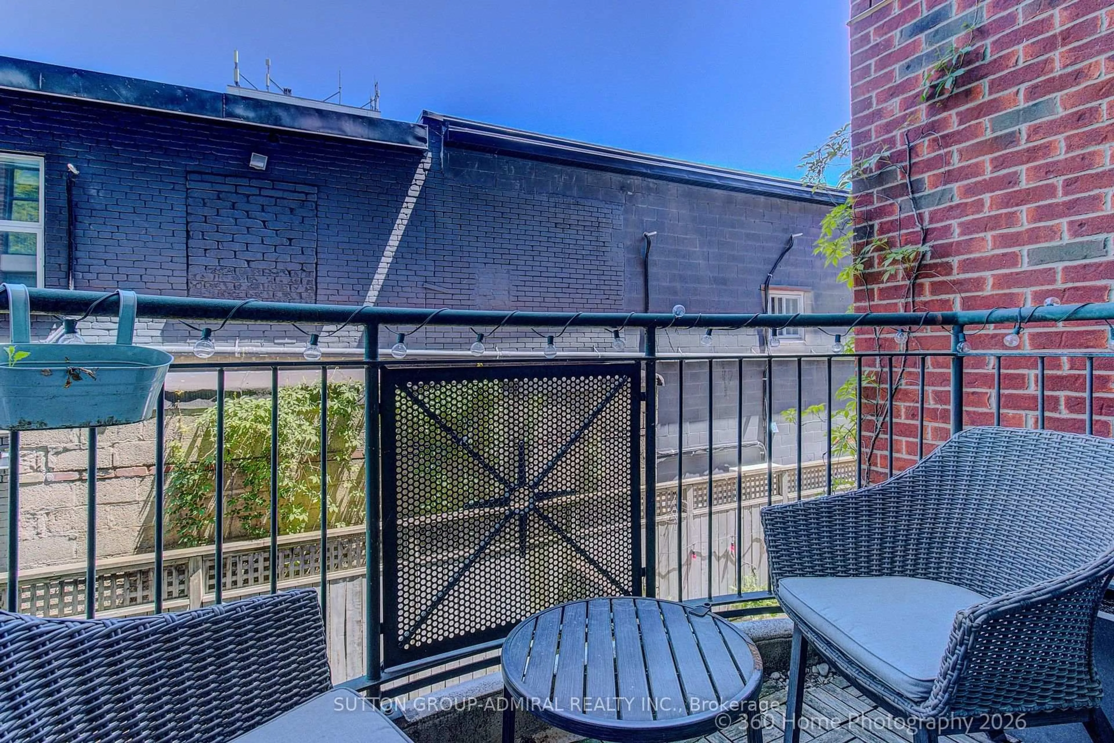 Patio, city buildings view from balcony for 901 Queen St #208, Toronto Ontario M6J 3X4