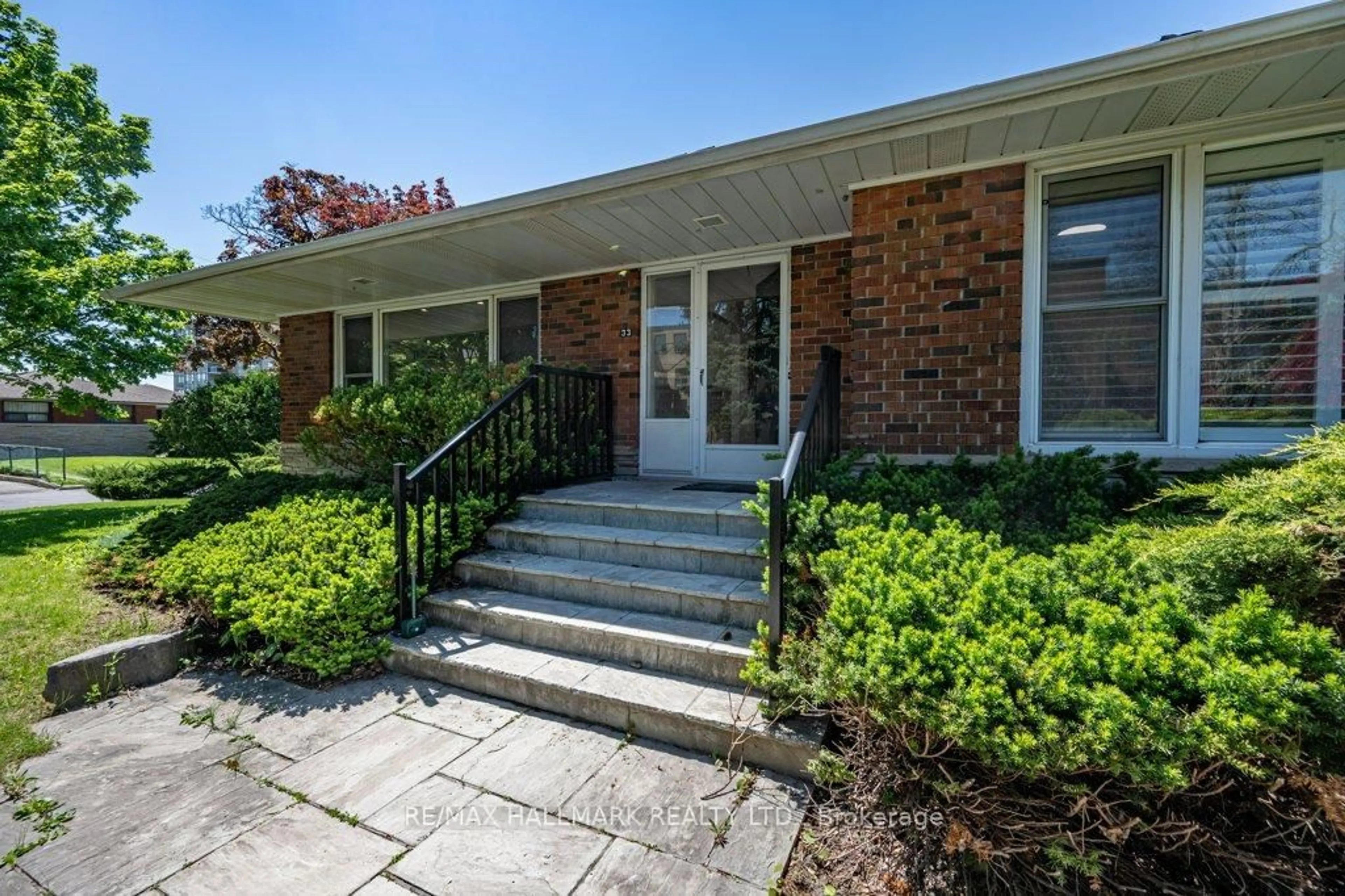 Home with brick exterior material, street for 33 Tinder Cres, Toronto Ontario M4A 1L2