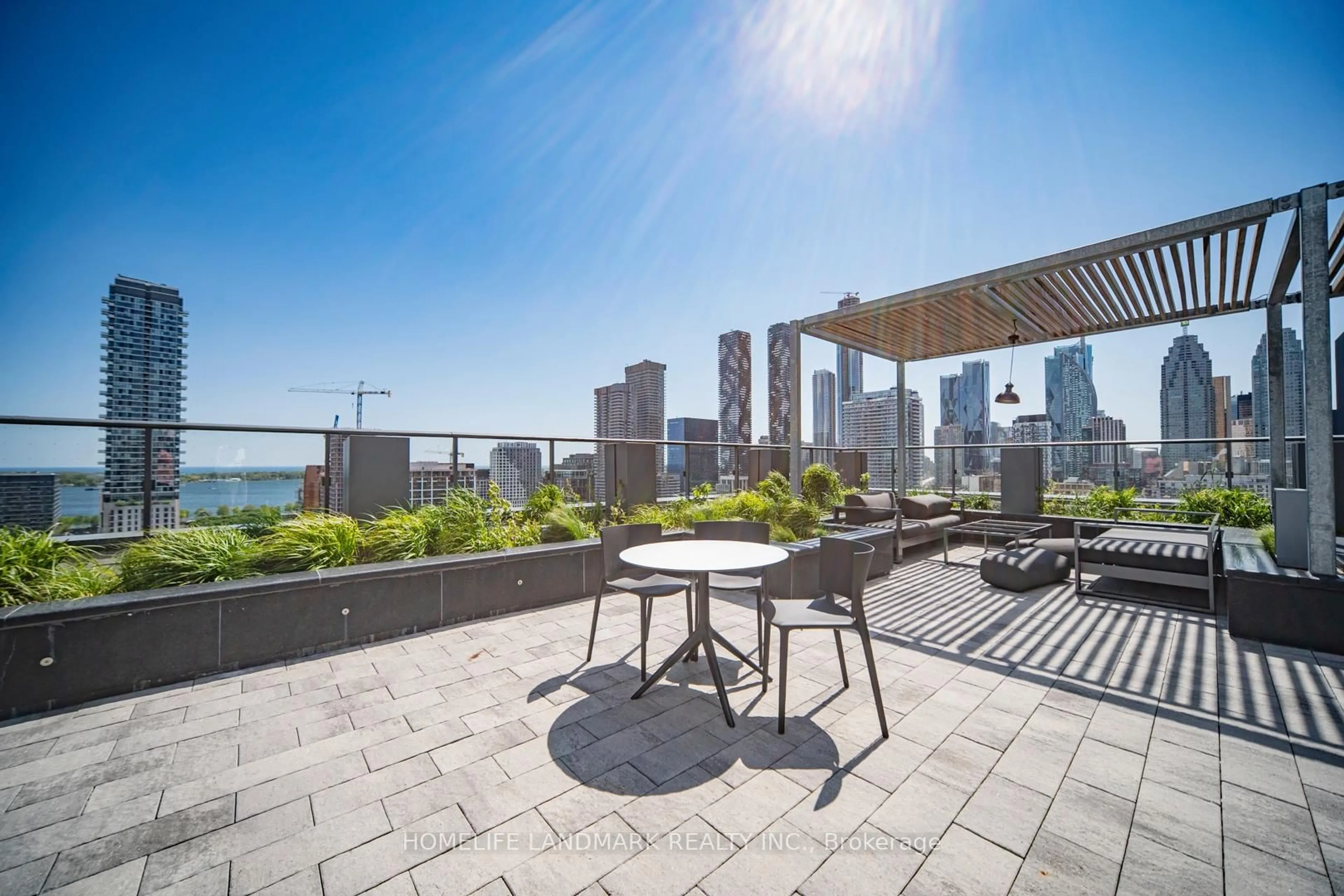 Patio, city buildings view from balcony for 121 Lower Sherbourne St #112, Toronto Ontario M5A 0W8