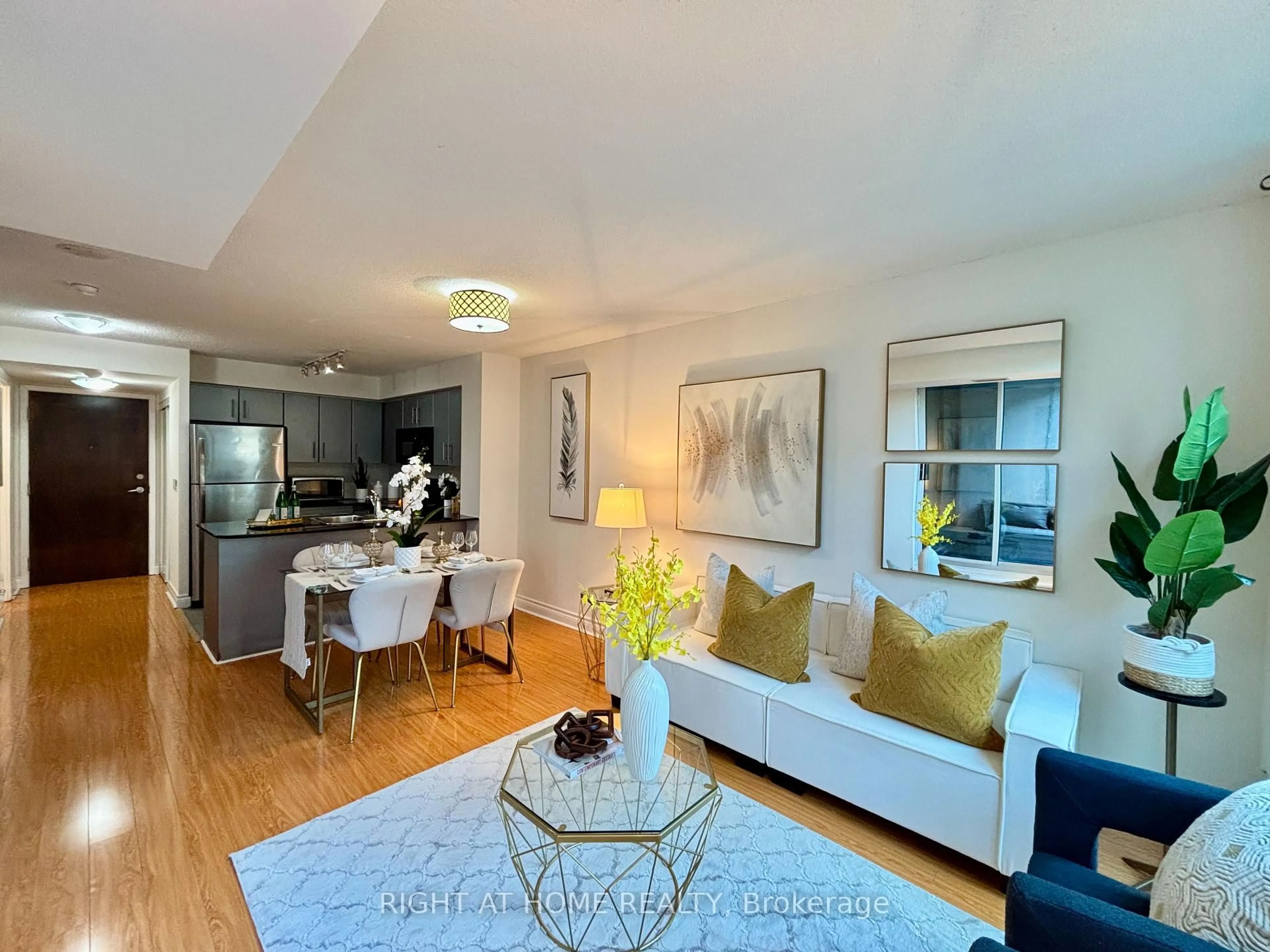 Living room with furniture, wood/laminate floor for 12 Yonge St #503, Toronto Ontario M5E 1Z9