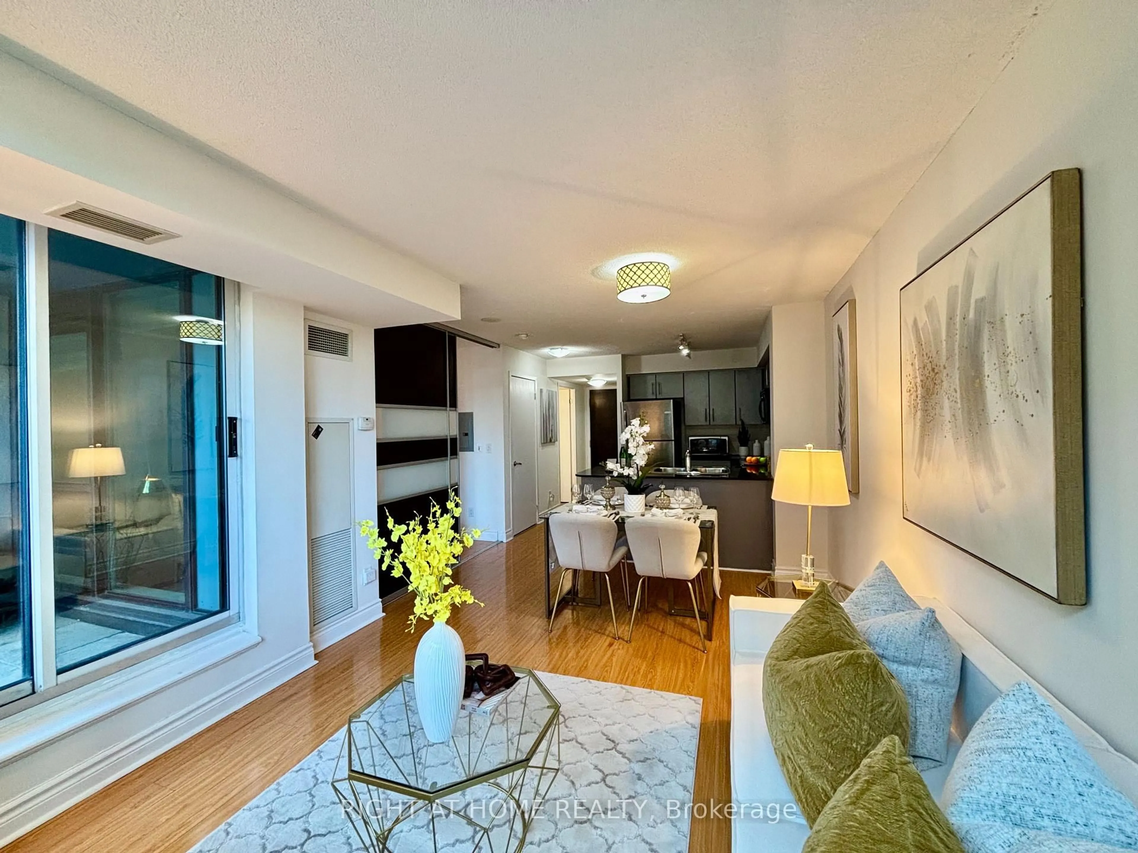 Living room with furniture, wood/laminate floor for 12 Yonge St #503, Toronto Ontario M5E 1Z9