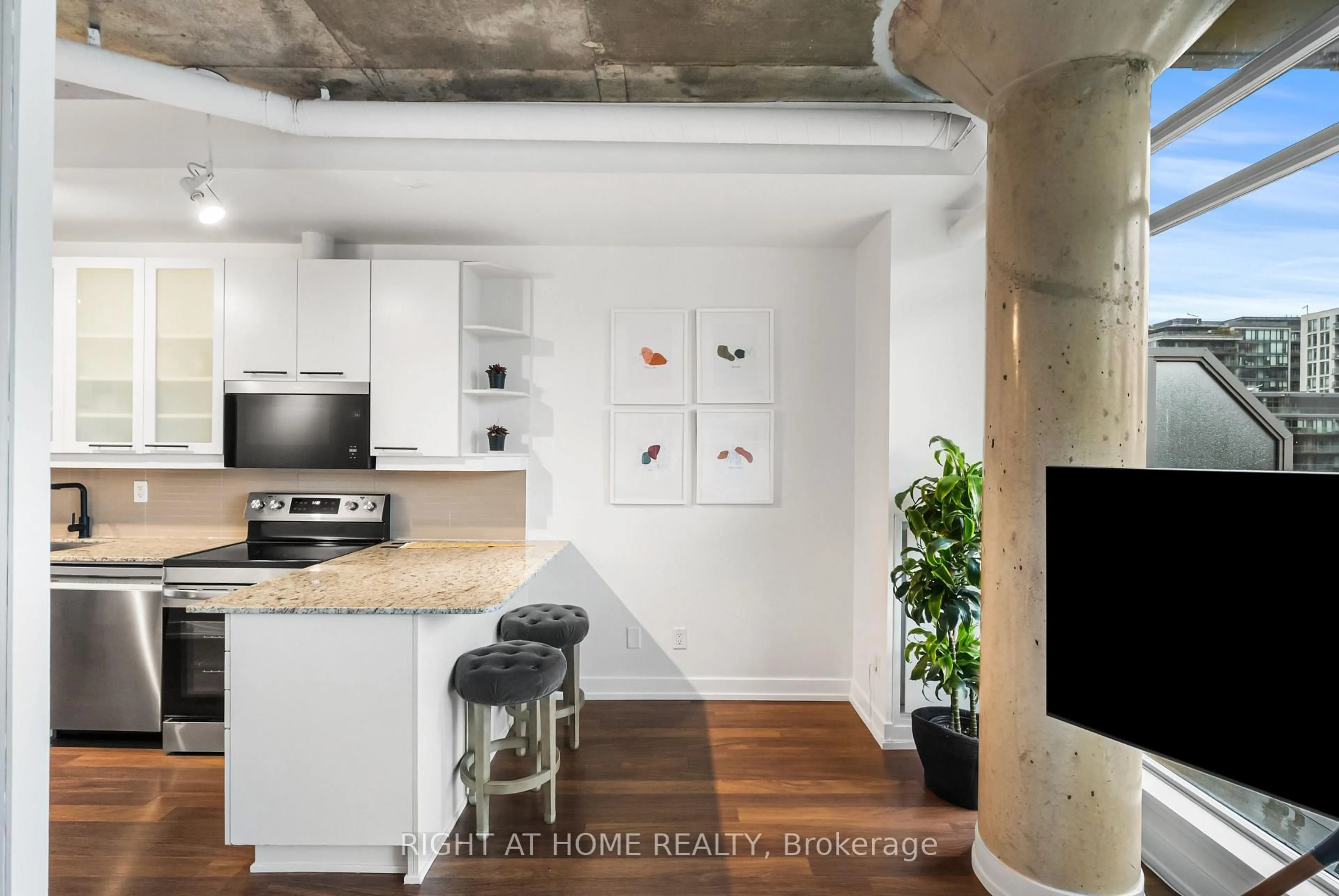 Open concept kitchen, cement floor for 66 Portland St #807, Toronto Ontario M5V 2M6