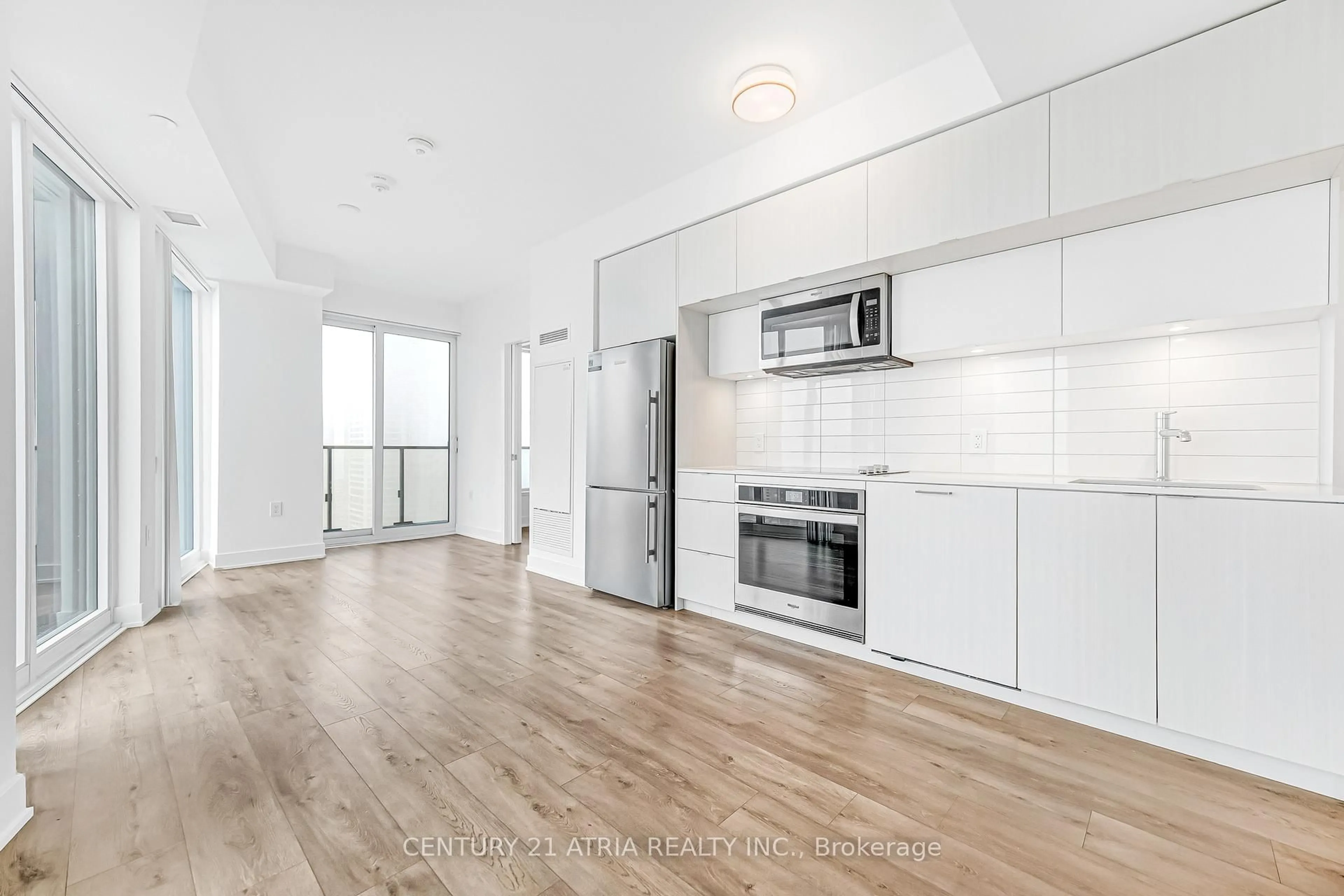 Open concept kitchen, wood/laminate floor for 575 Bloor St #3308, Toronto Ontario M4W 0B2