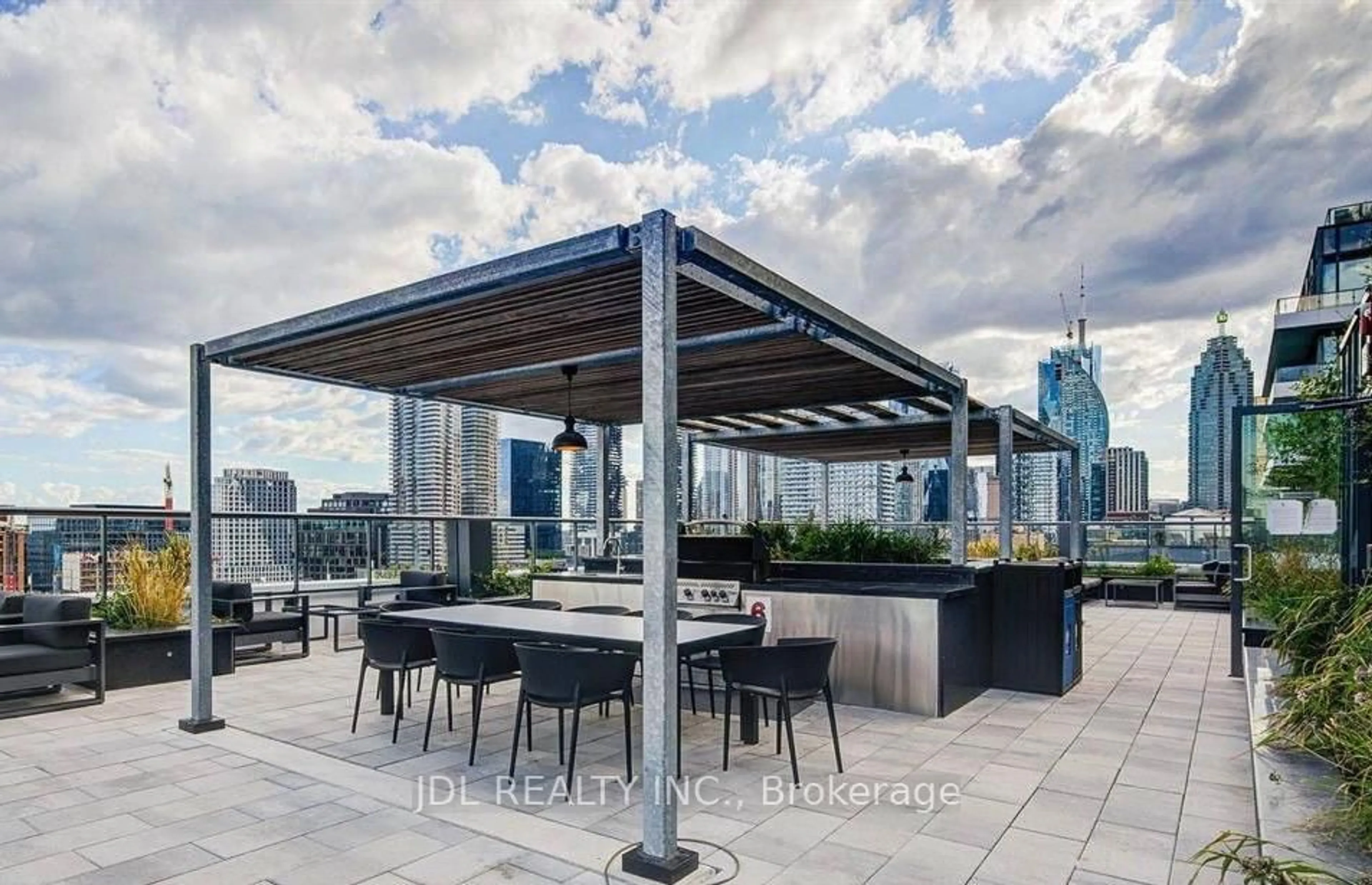 Patio, city buildings view from balcony for 70 Princess St #701, Toronto Ontario M5A 0X6