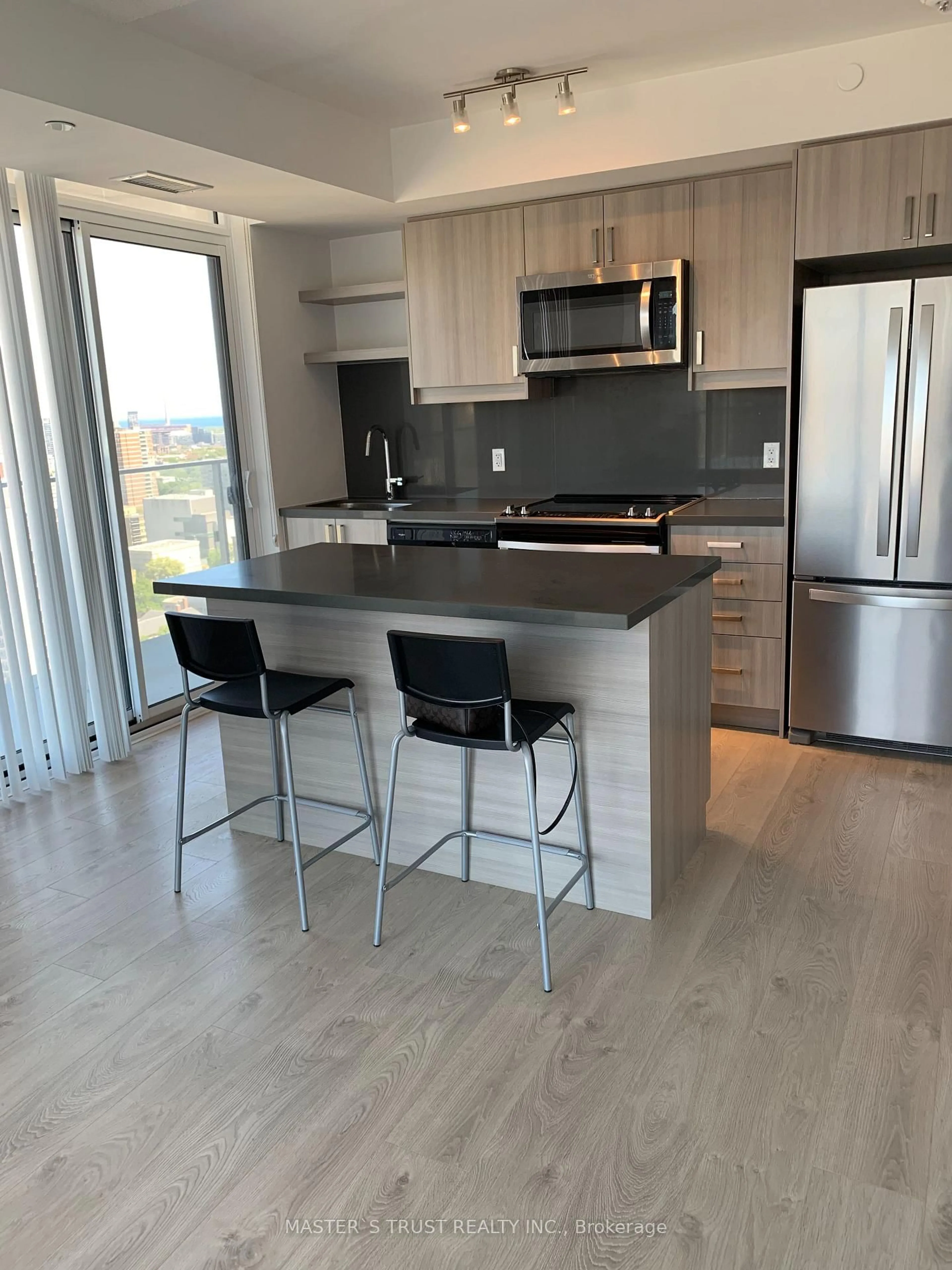 Open concept kitchen, wood/laminate floor for 50 Wellesley East St #2704, Toronto Ontario M4Y 1G2