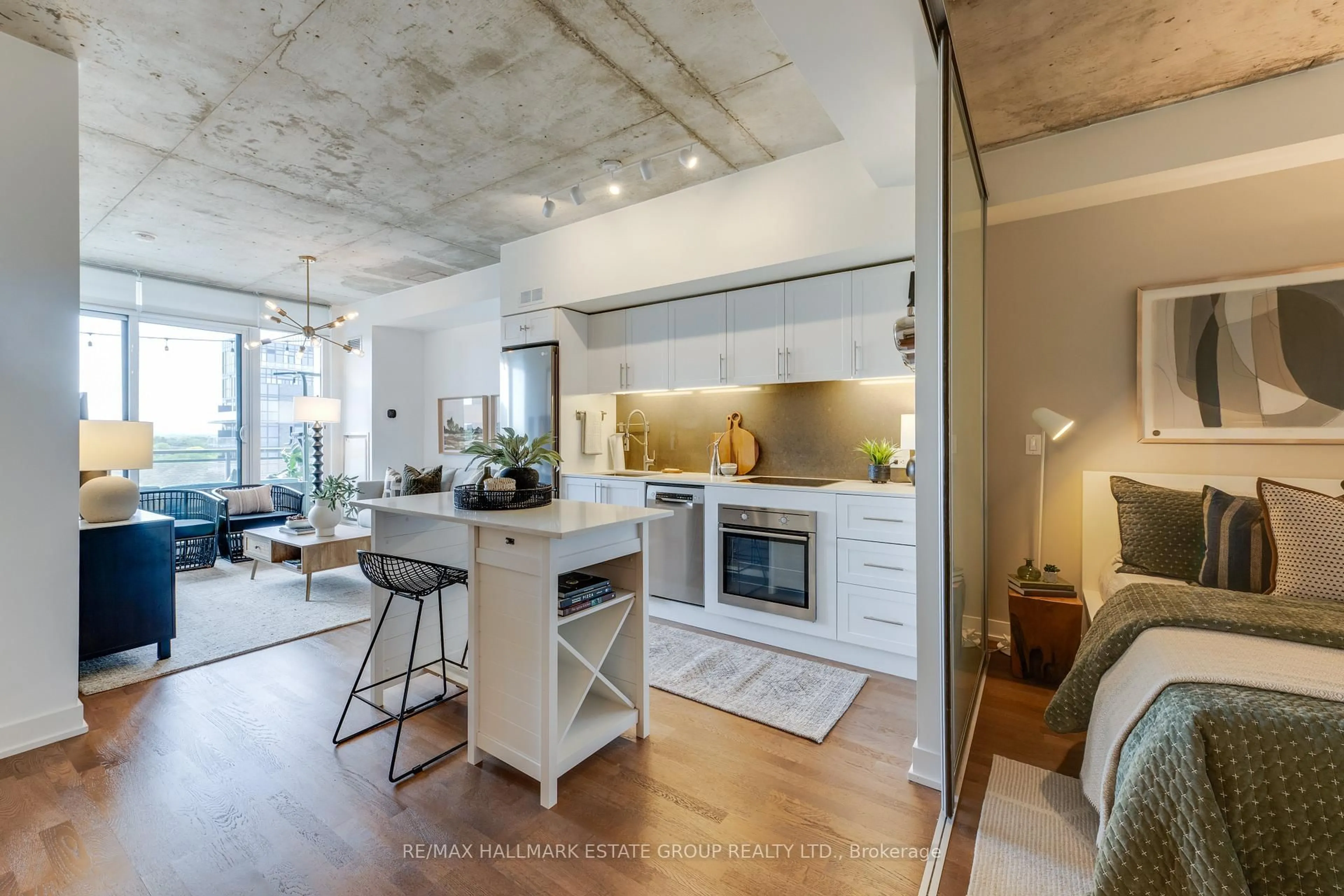 Open concept kitchen, cement floor for 20 Minowan Miikan Lane #1018, Toronto Ontario M6J 0E5