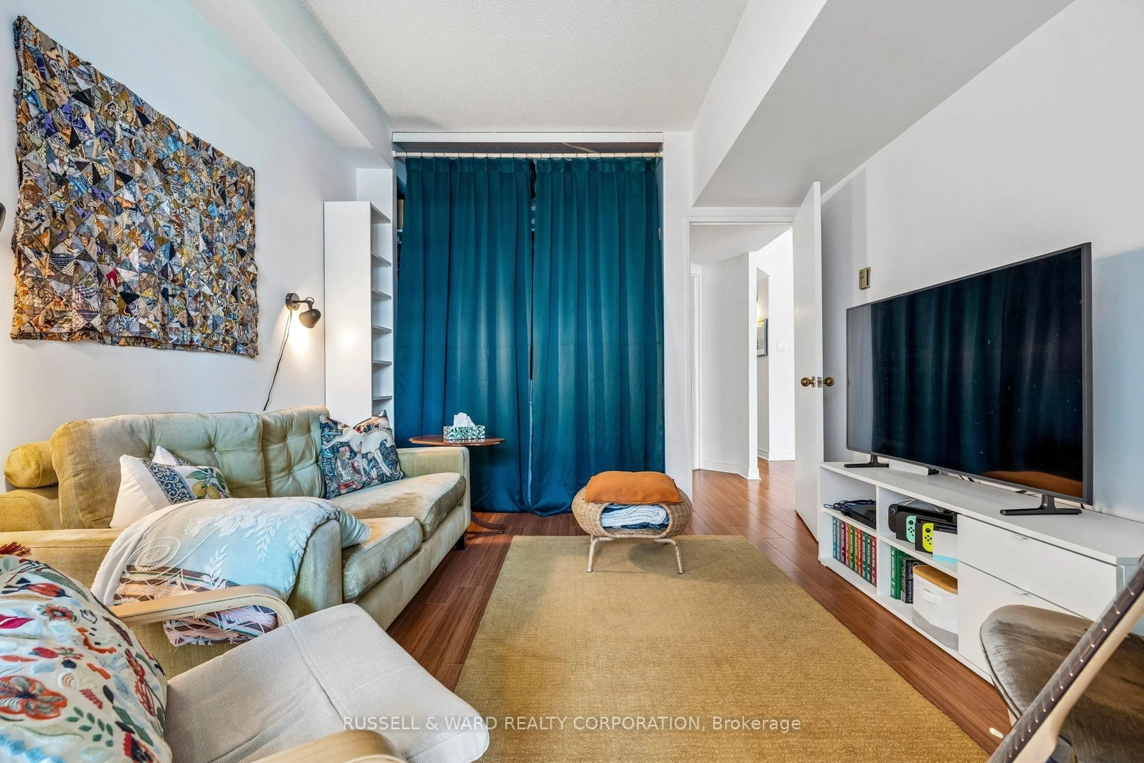 Living room with furniture, unknown for 65 Scadding Ave #911, Toronto Ontario M5A 4L1