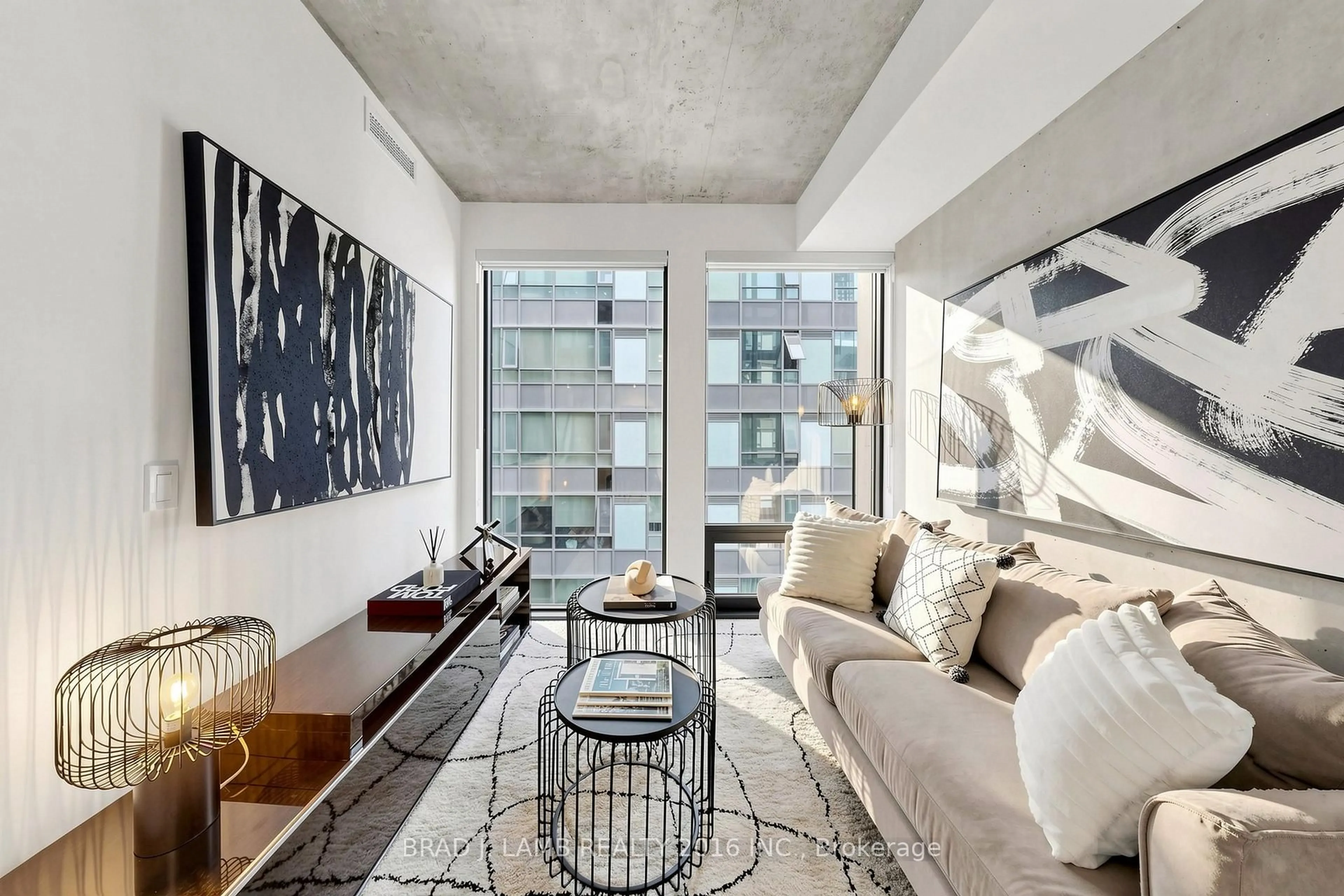 Living room with furniture, cement floor for 284 King St #701, Toronto Ontario M5A 1K4