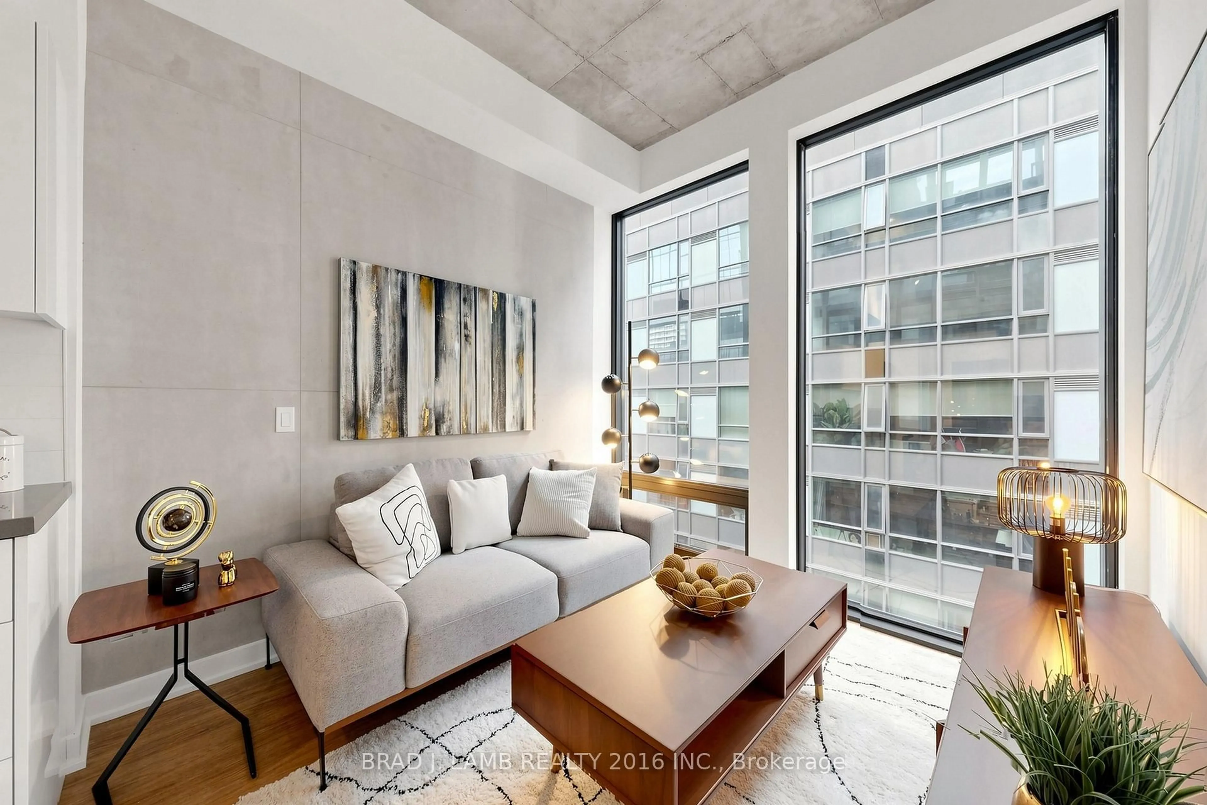Living room with furniture, cement floor for 284 King St #808, Toronto Ontario M5A 1K4