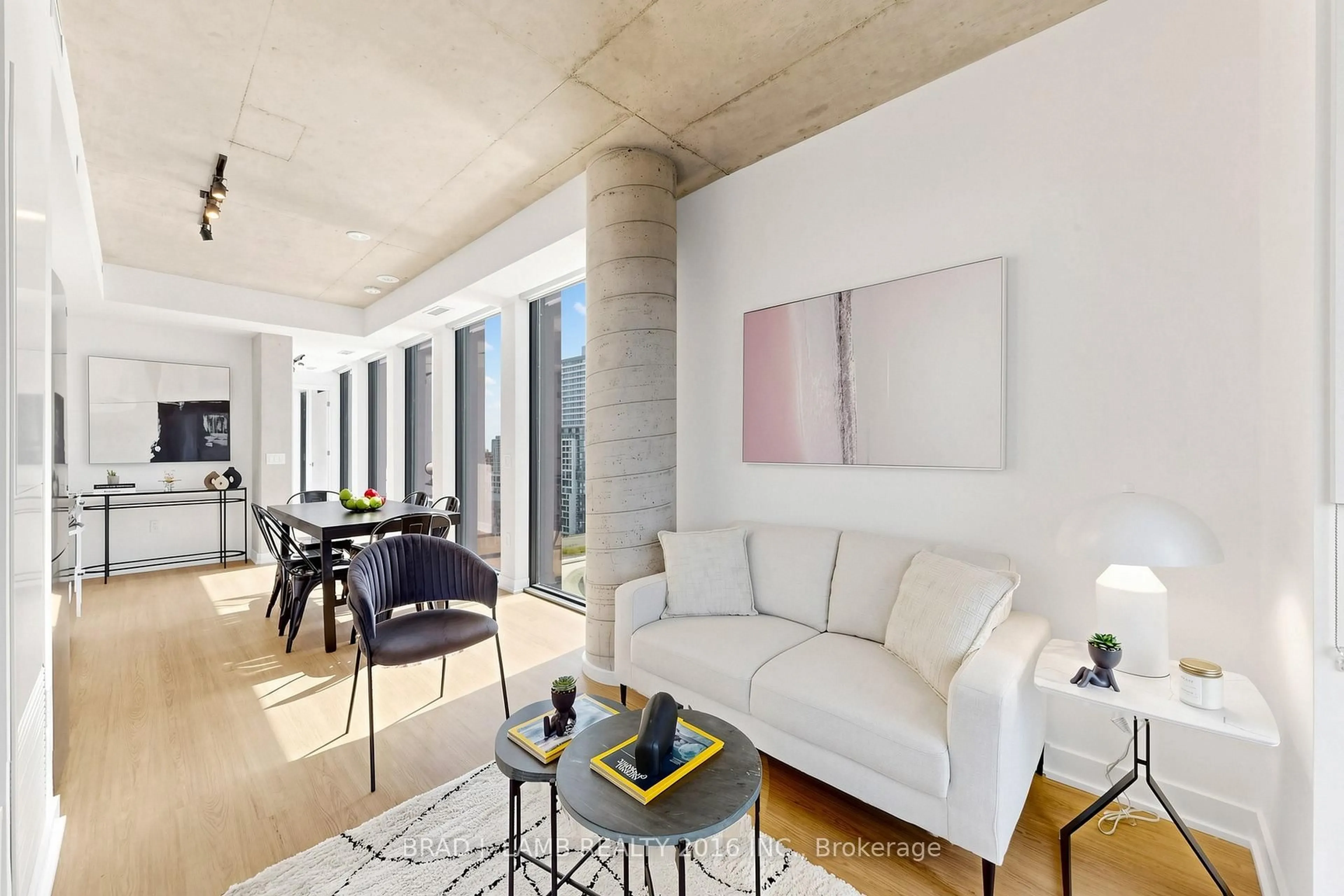 Living room with furniture, cement floor for 284 King St #1505, Toronto Ontario M5A 1K4