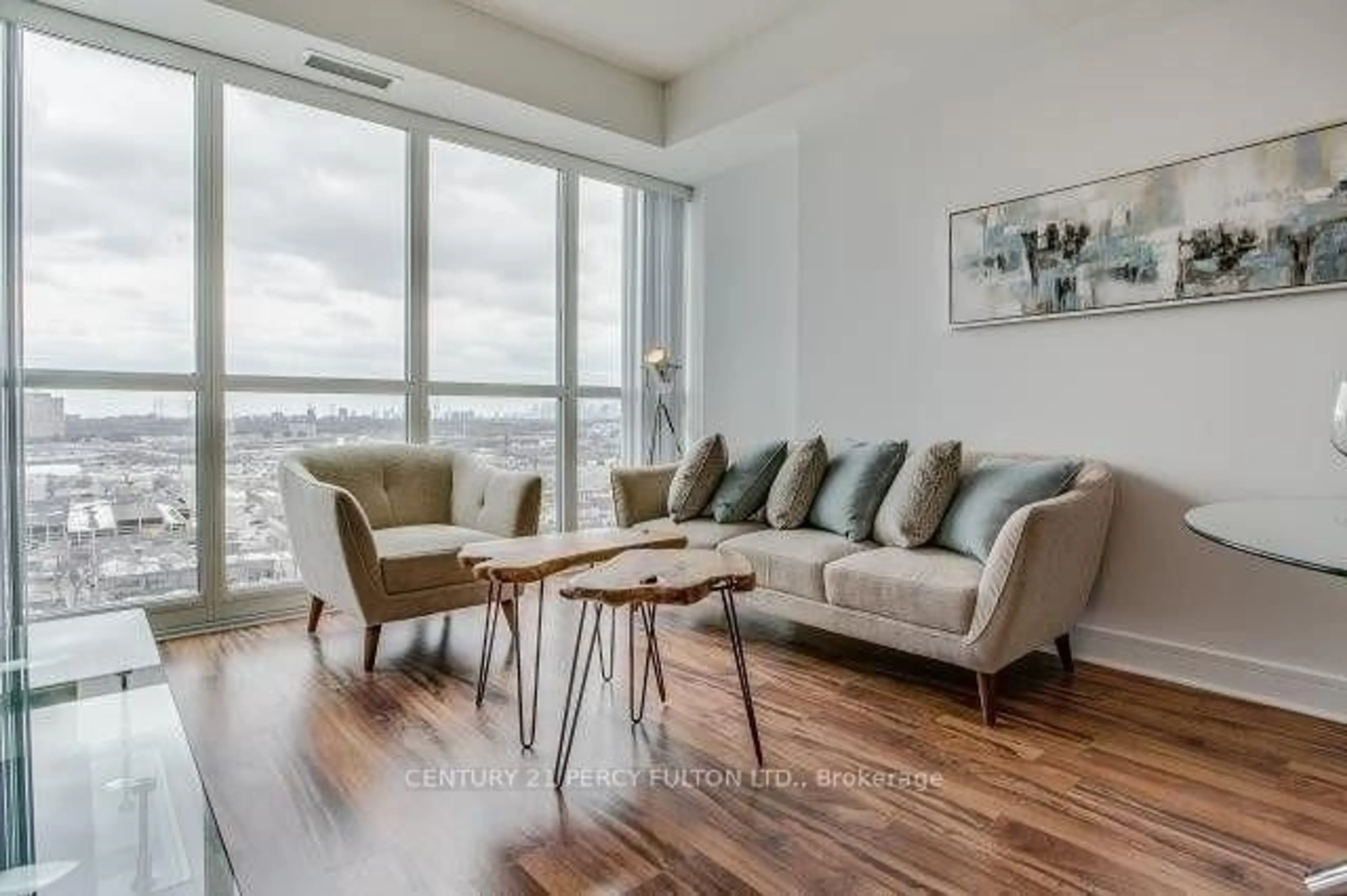Living room with furniture, wood/laminate floor for 35 Brian Peck Cres #1510, Toronto Ontario M4G 0A5