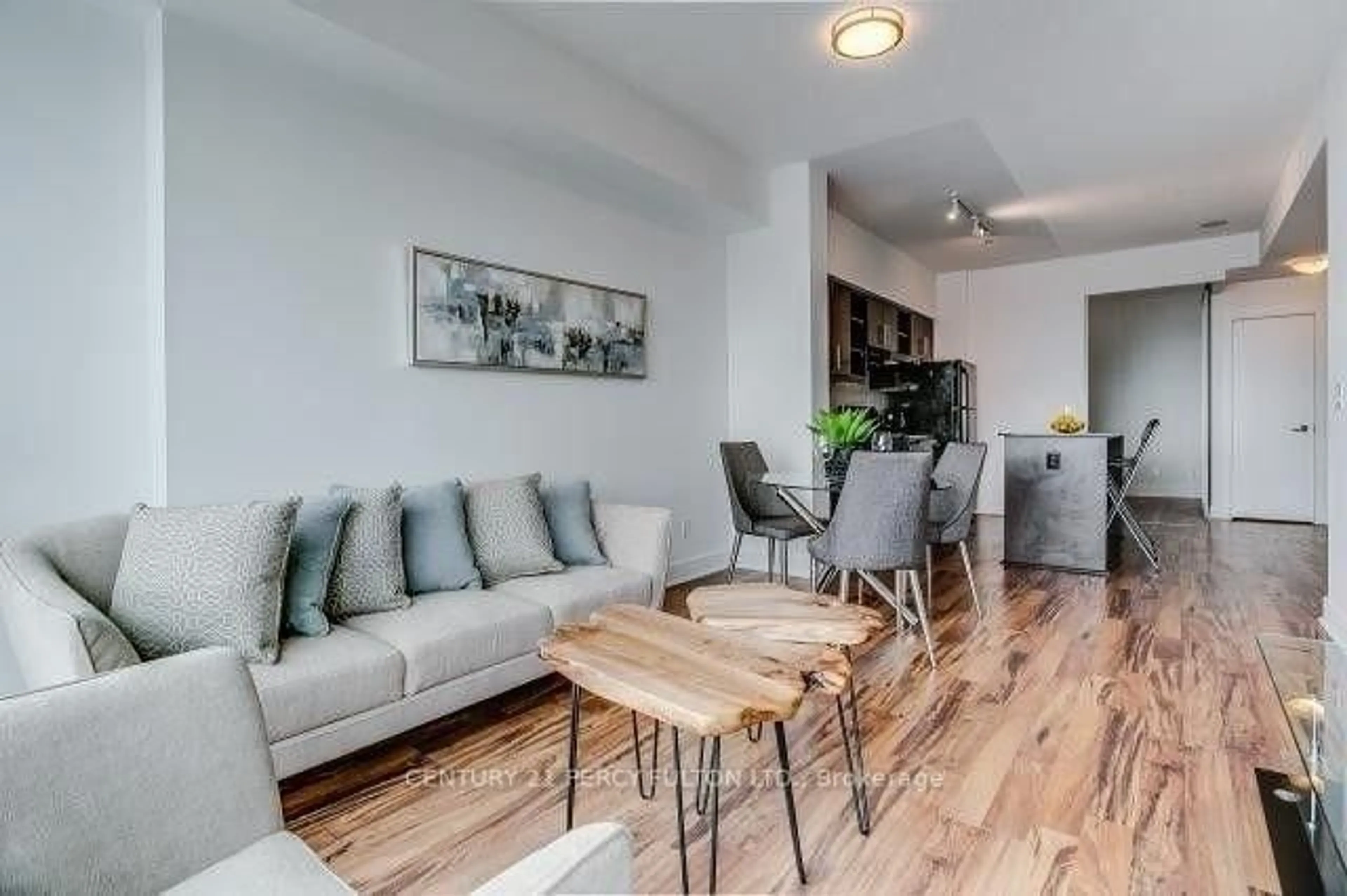 Living room with furniture, wood/laminate floor for 35 Brian Peck Cres #1510, Toronto Ontario M4G 0A5