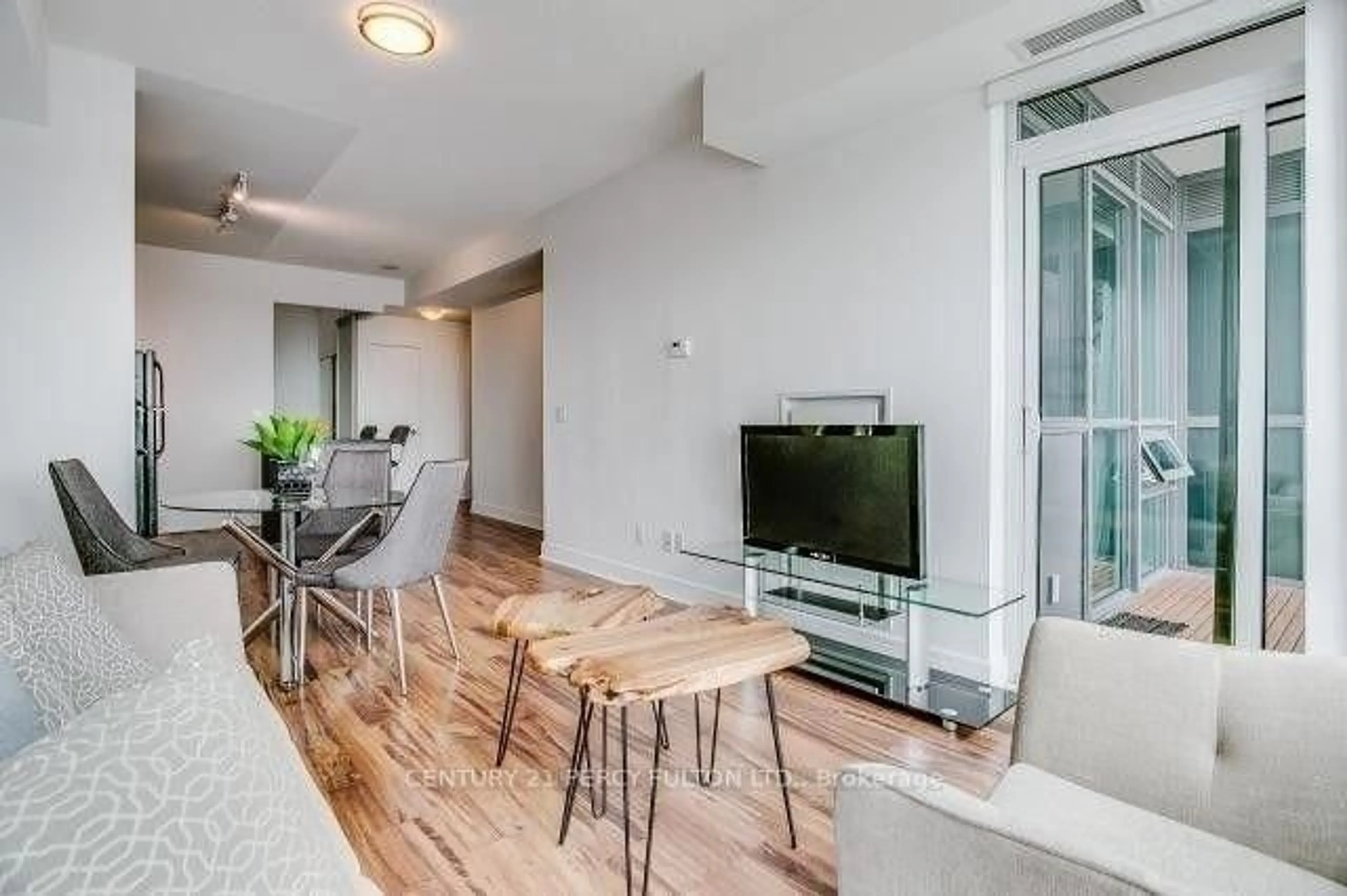 Living room with furniture, wood/laminate floor for 35 Brian Peck Cres #1510, Toronto Ontario M4G 0A5