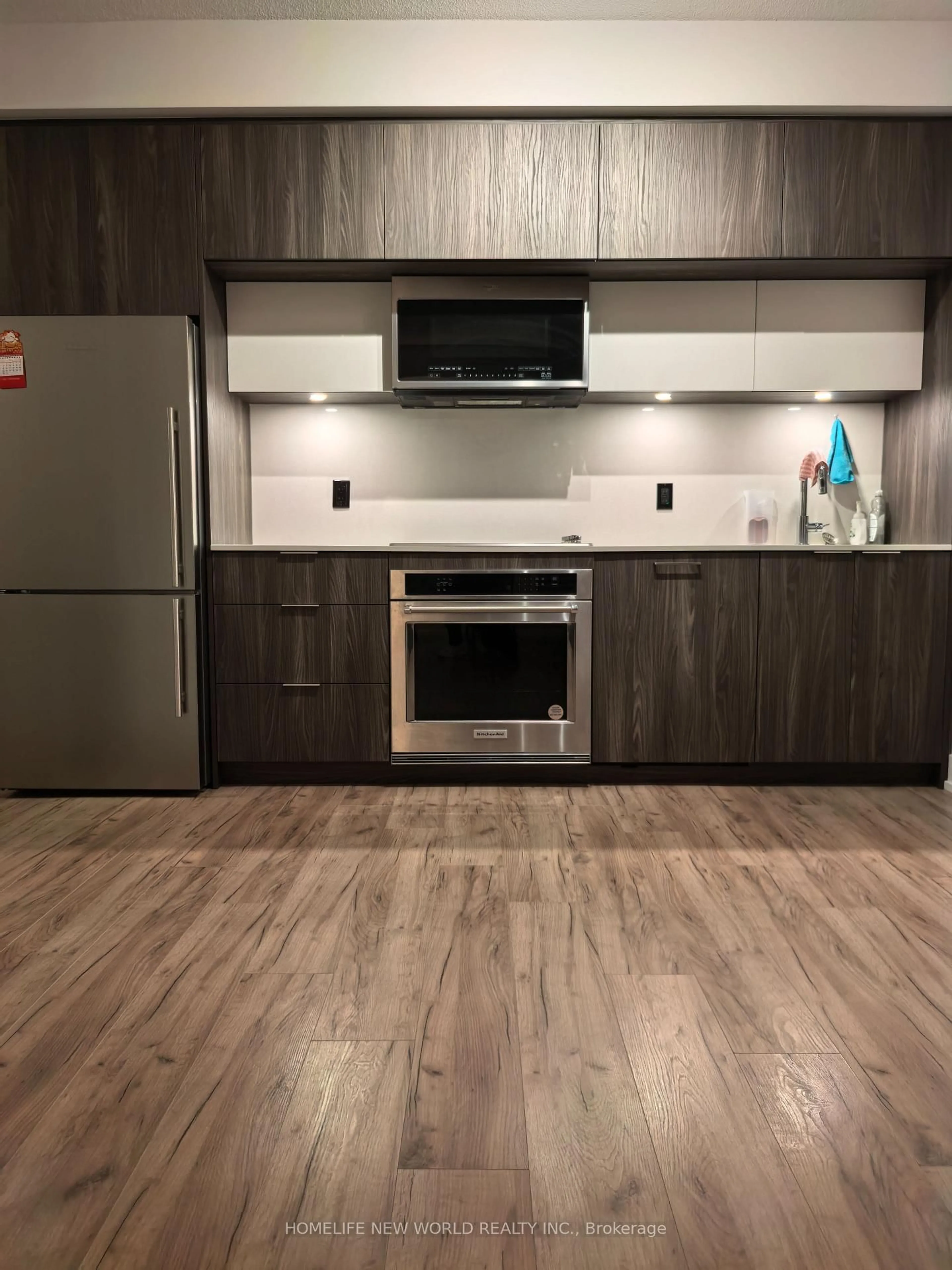 Open concept kitchen, wood/laminate floor for 25 Adra Grado Way #1230, Toronto Ontario M2J 0H6