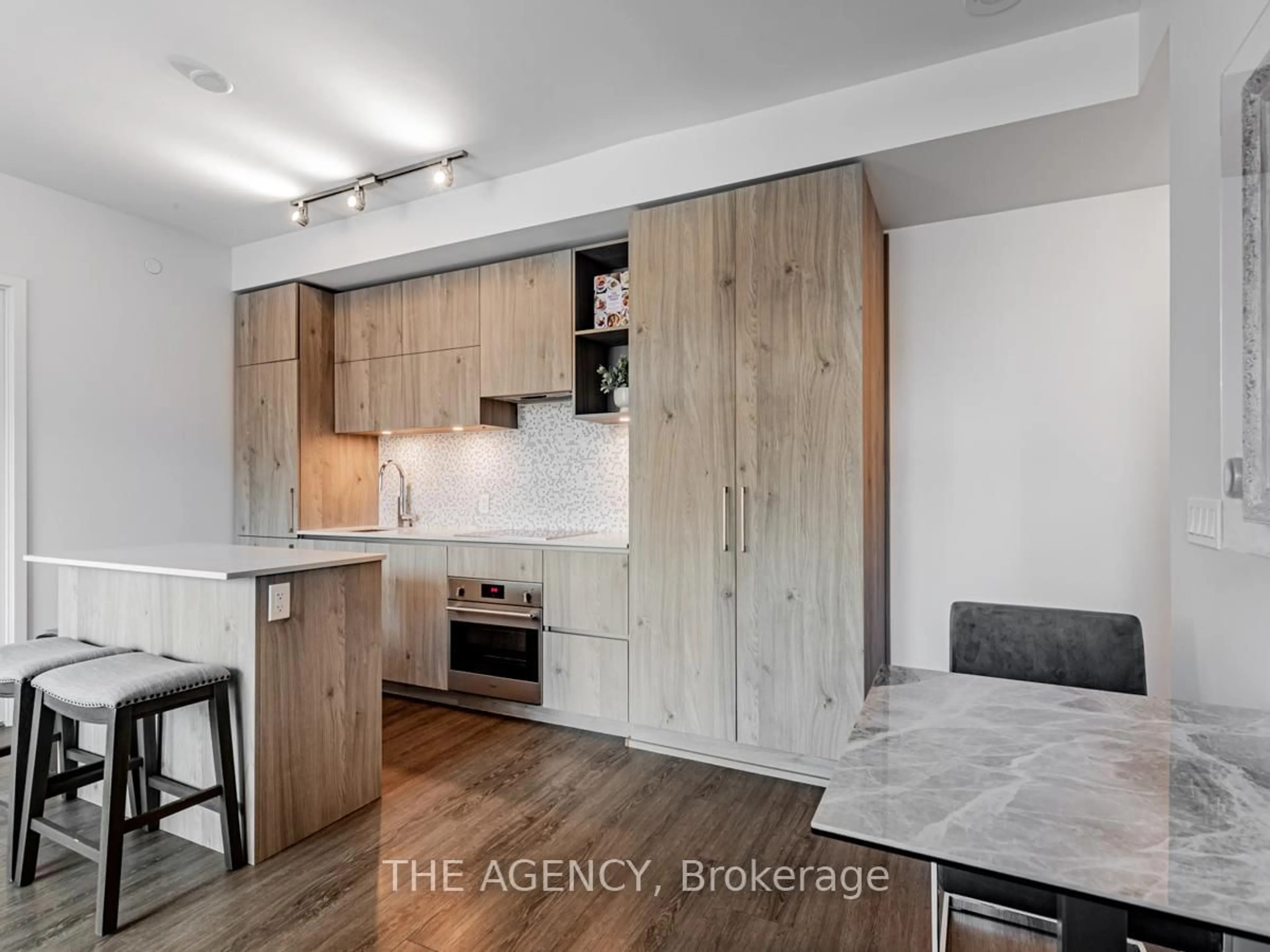Open concept kitchen, wood/laminate floor for 1 Yorkville Ave #711, Toronto Ontario M4W 1L1