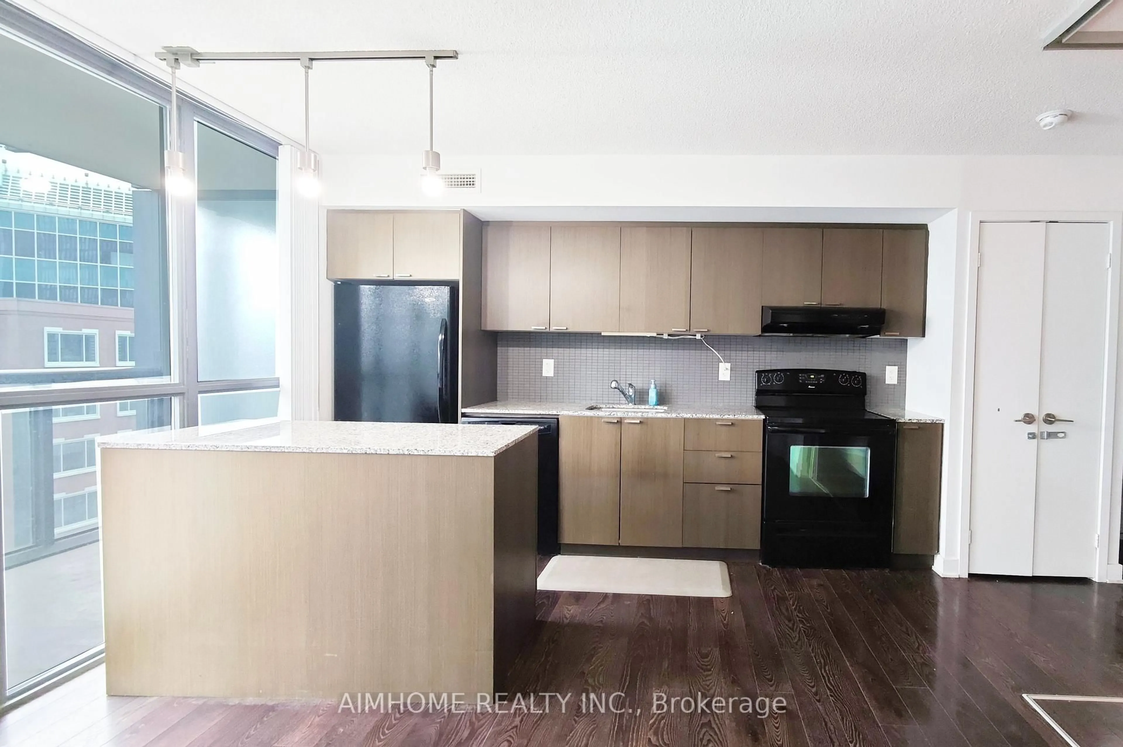 Open concept kitchen, wood/laminate floor for 110 Charles St #1510, Toronto Ontario M4Y 1T5