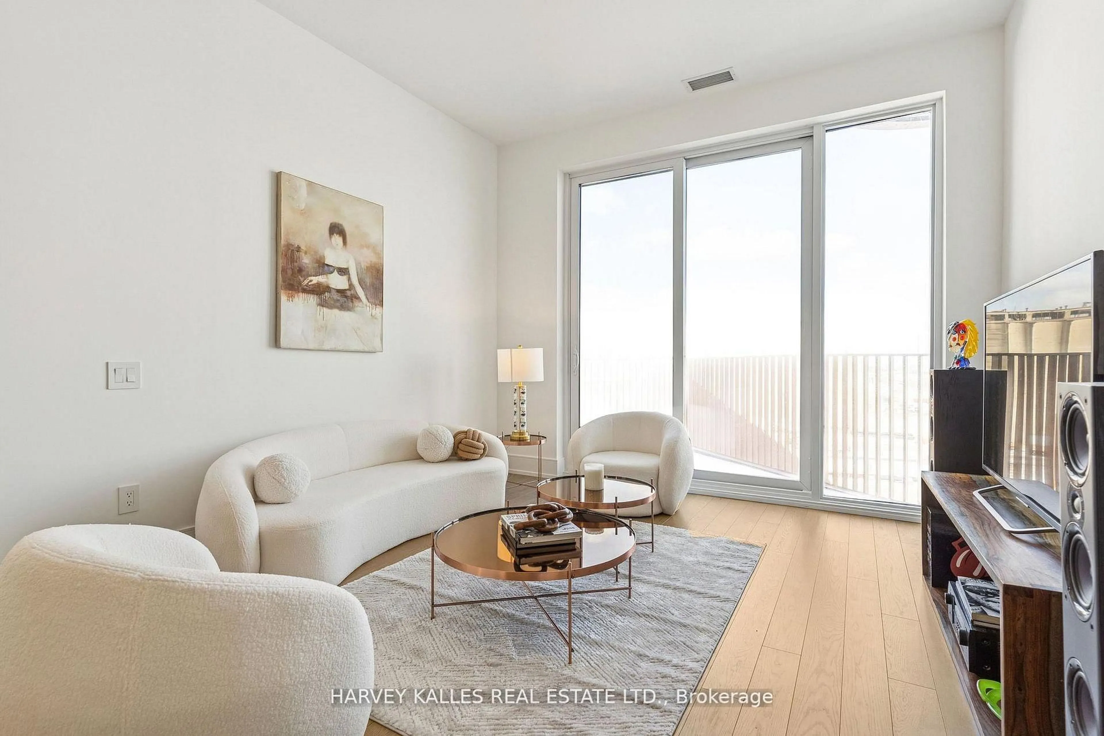 Living room with furniture, wood/laminate floor for 155 Merchants' Wharf Ave #701, Toronto Ontario M5A 0Y4