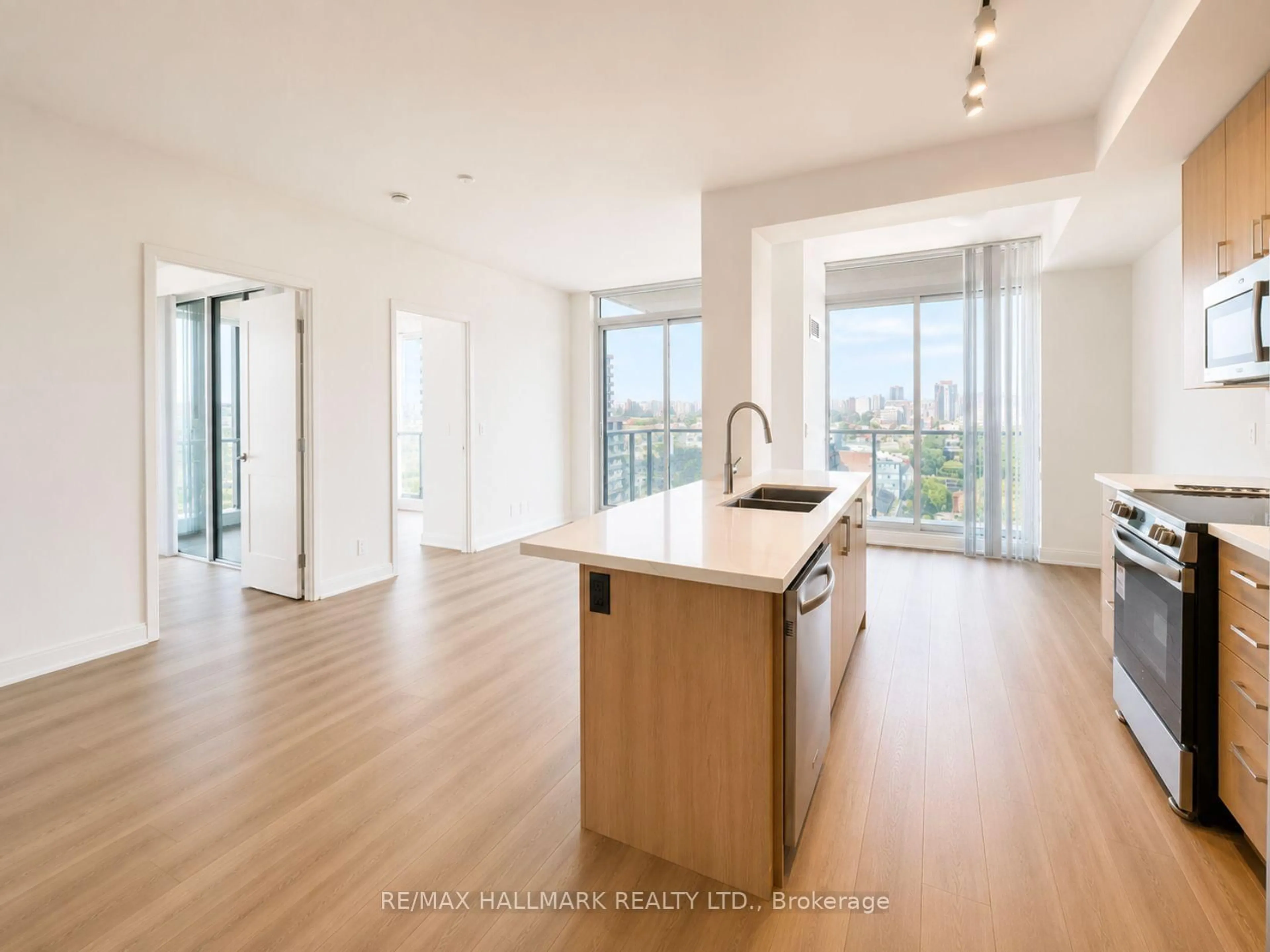 Open concept kitchen, wood/laminate floor for 825 Church St #1902, Toronto Ontario M4W 3Z4