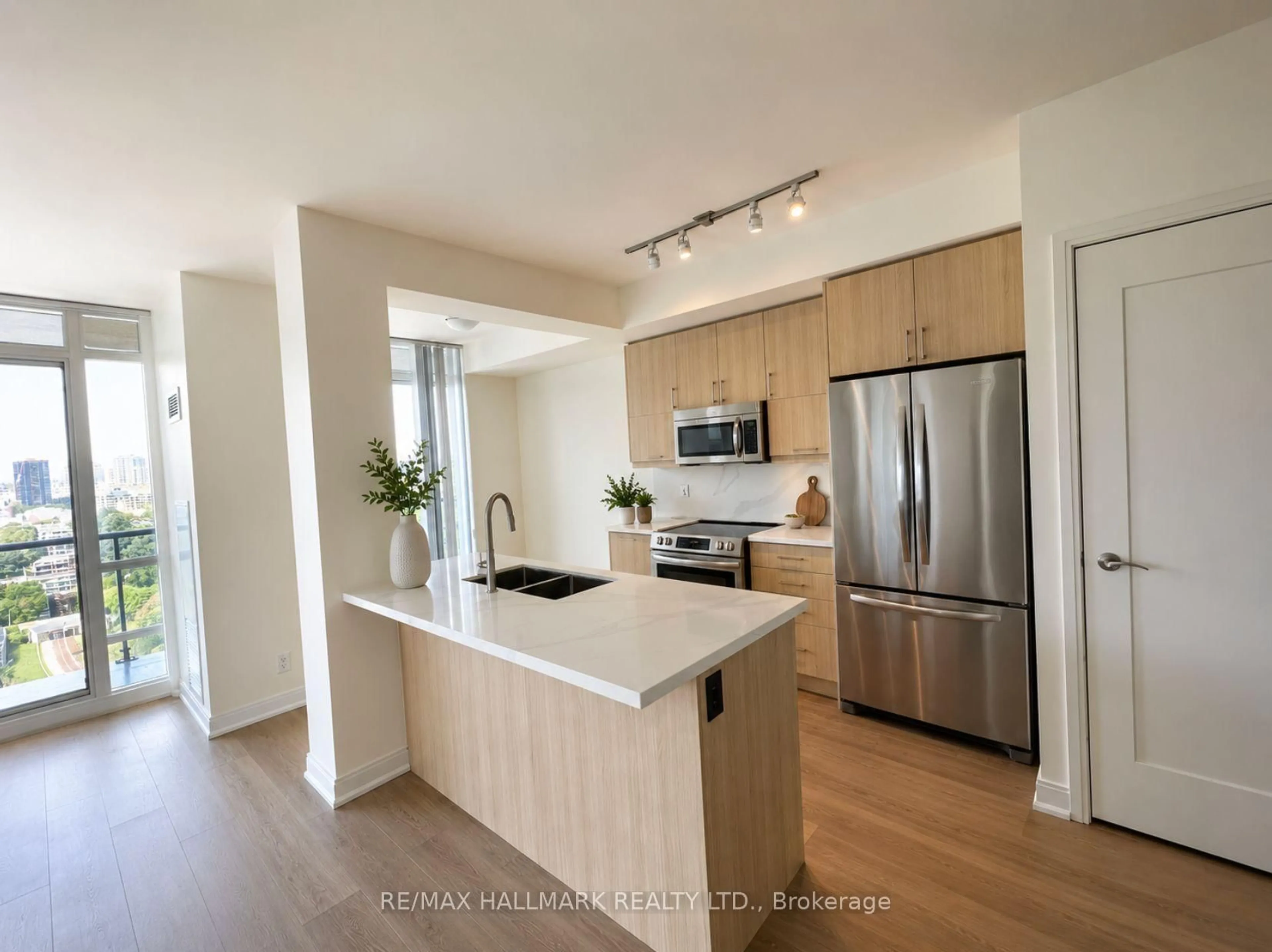 Open concept kitchen, wood/laminate floor for 825 Church St #1902, Toronto Ontario M4W 3Z4