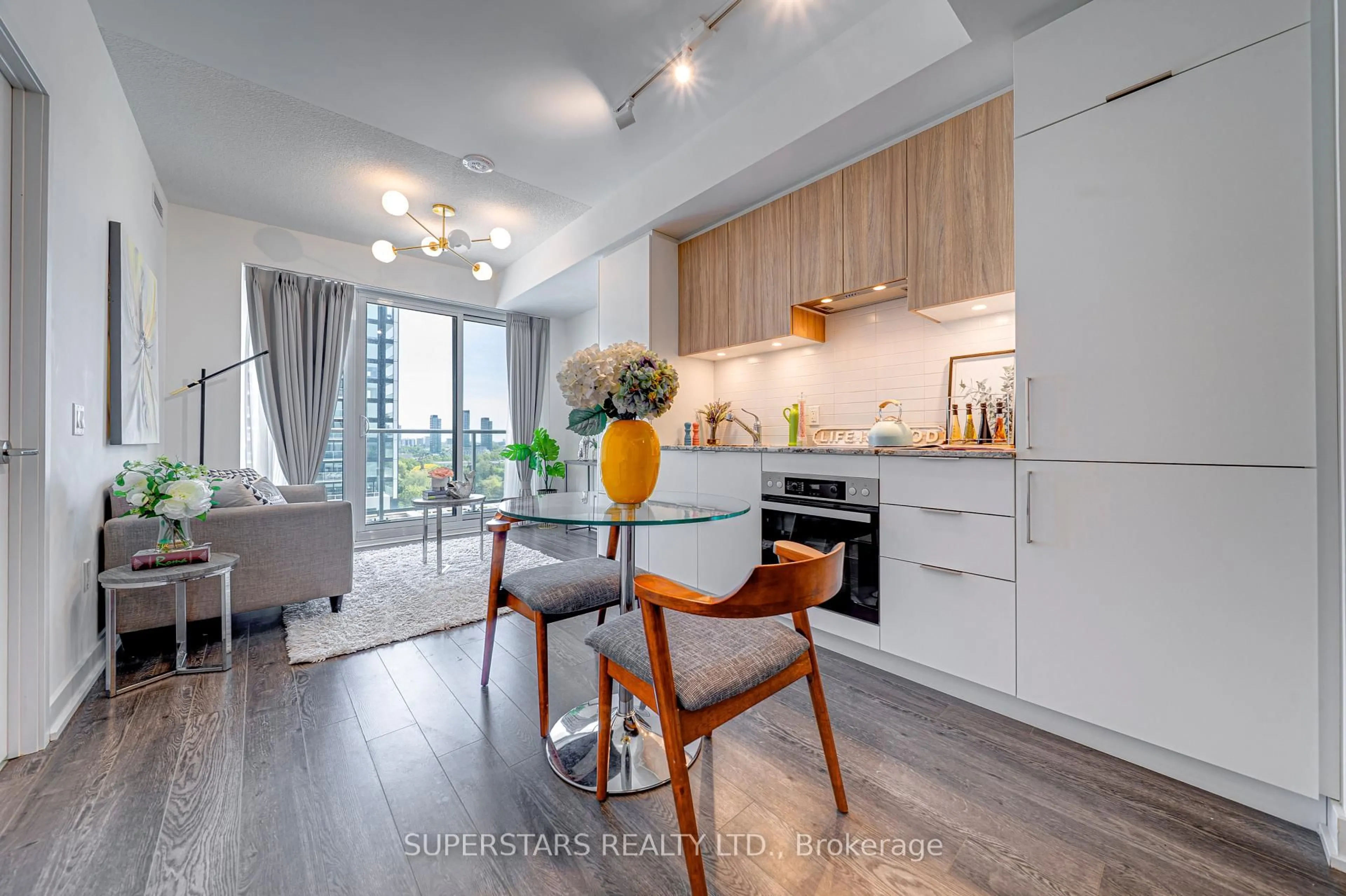 Open concept kitchen, wood/laminate floor for 50 O'Neill Rd #1001, Toronto Ontario M3C 0R1