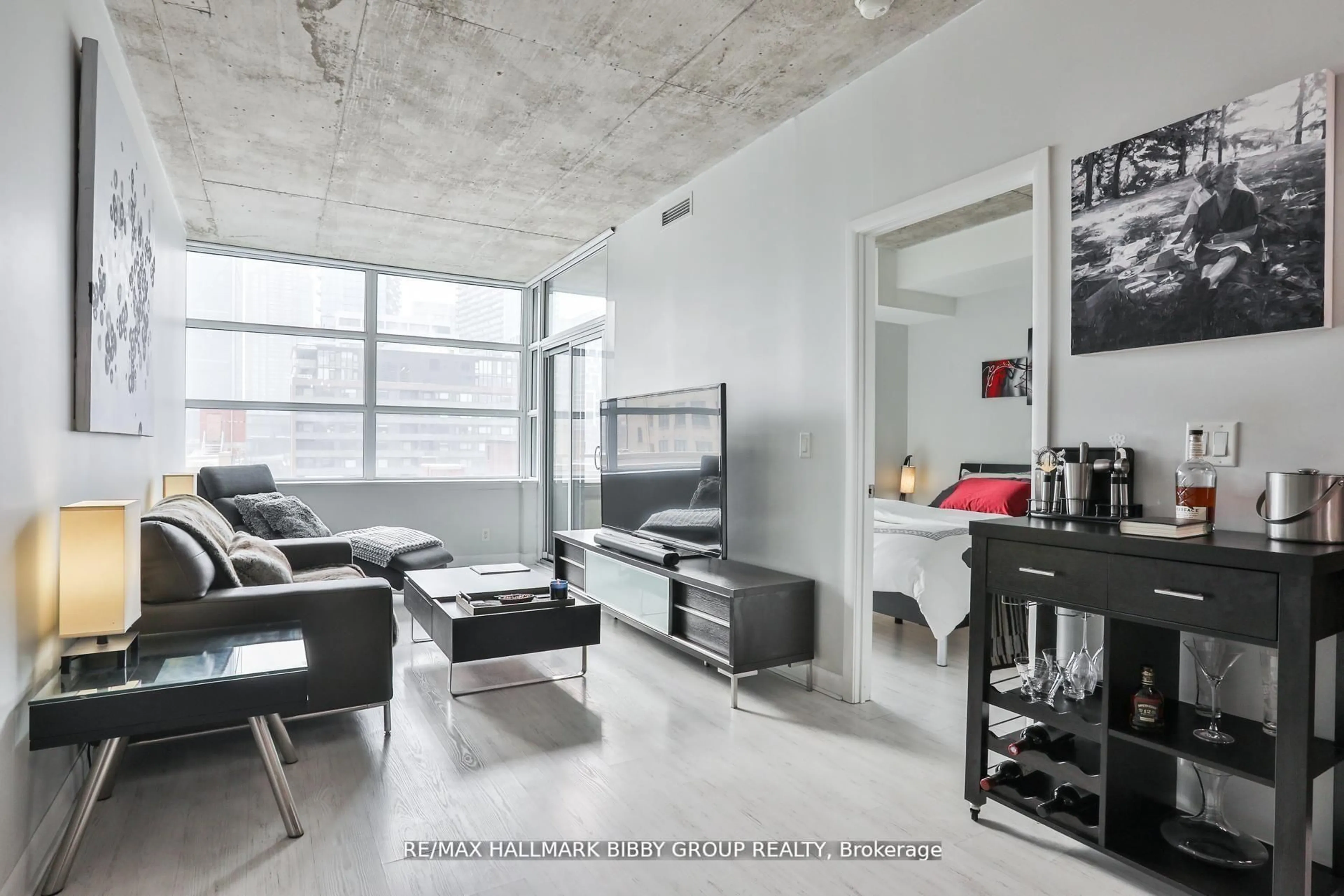 Living room with furniture, cement floor for 478 King St #606, Toronto Ontario M5V 0A8