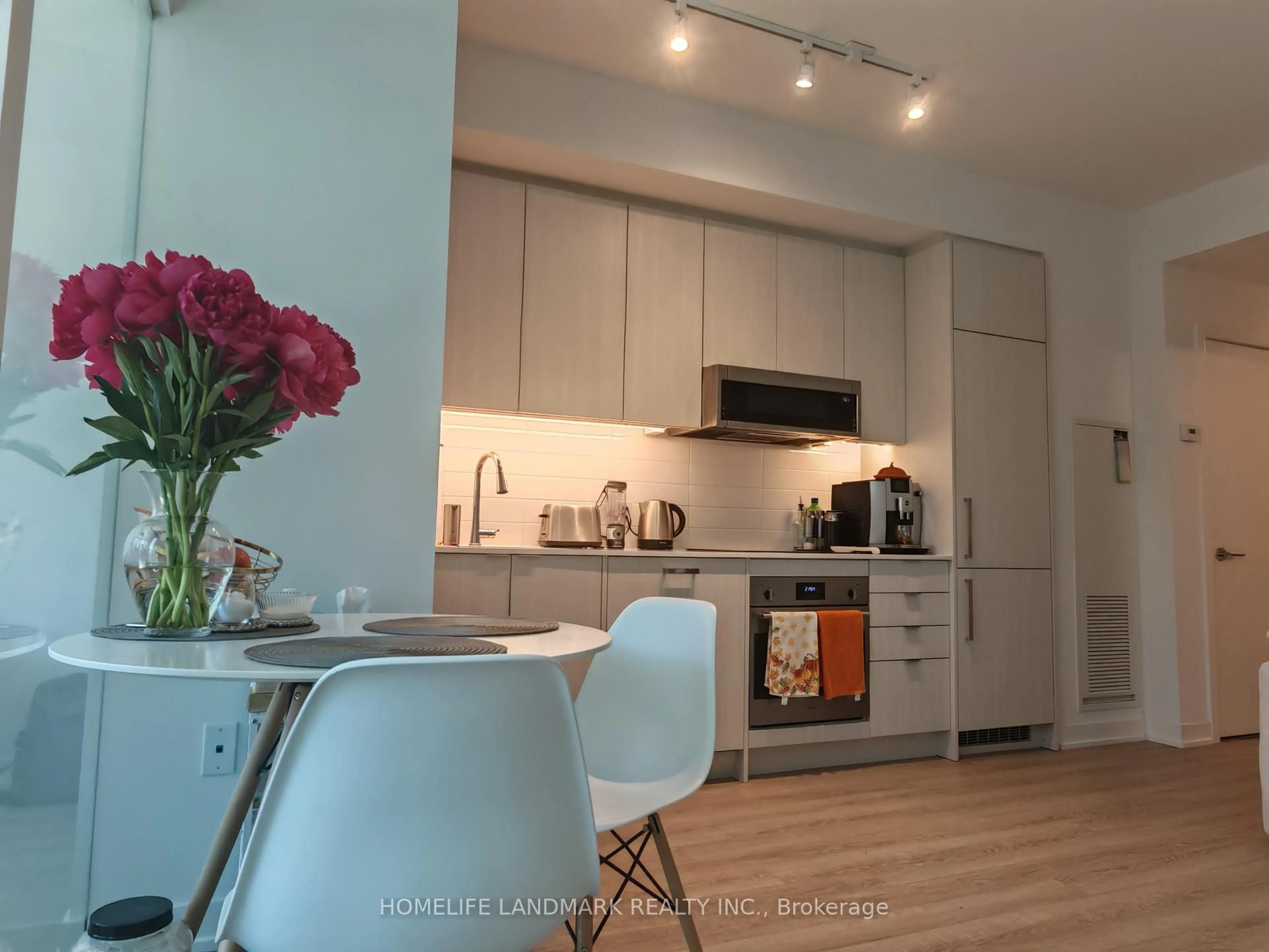 Open concept kitchen, wood/laminate floor for 250 Lawrence Ave #310, Toronto Ontario M5M 1B2