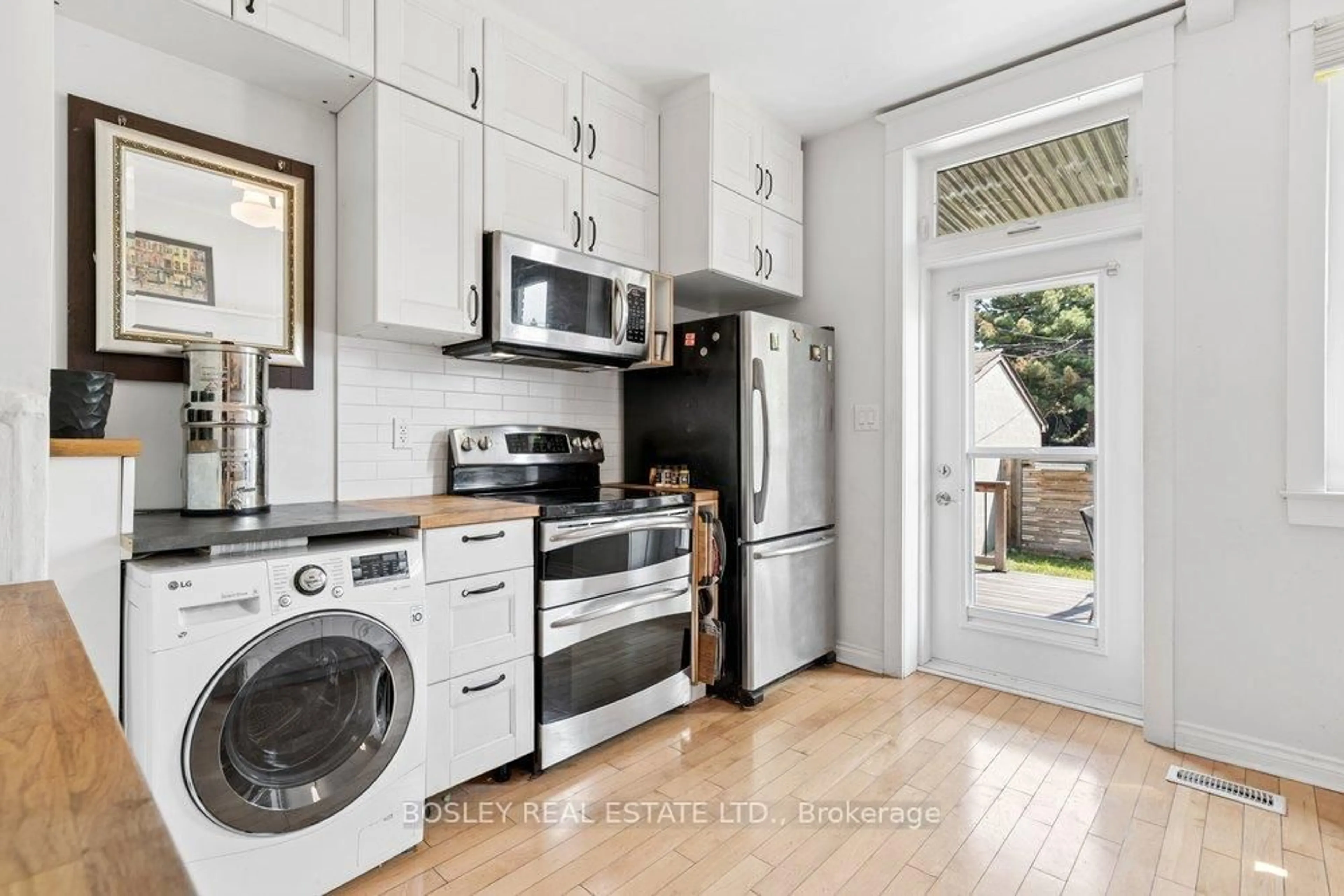 Kitchen with laundary machines, unknown for 159A Gladstone Ave, Toronto Ontario M6J 3L3