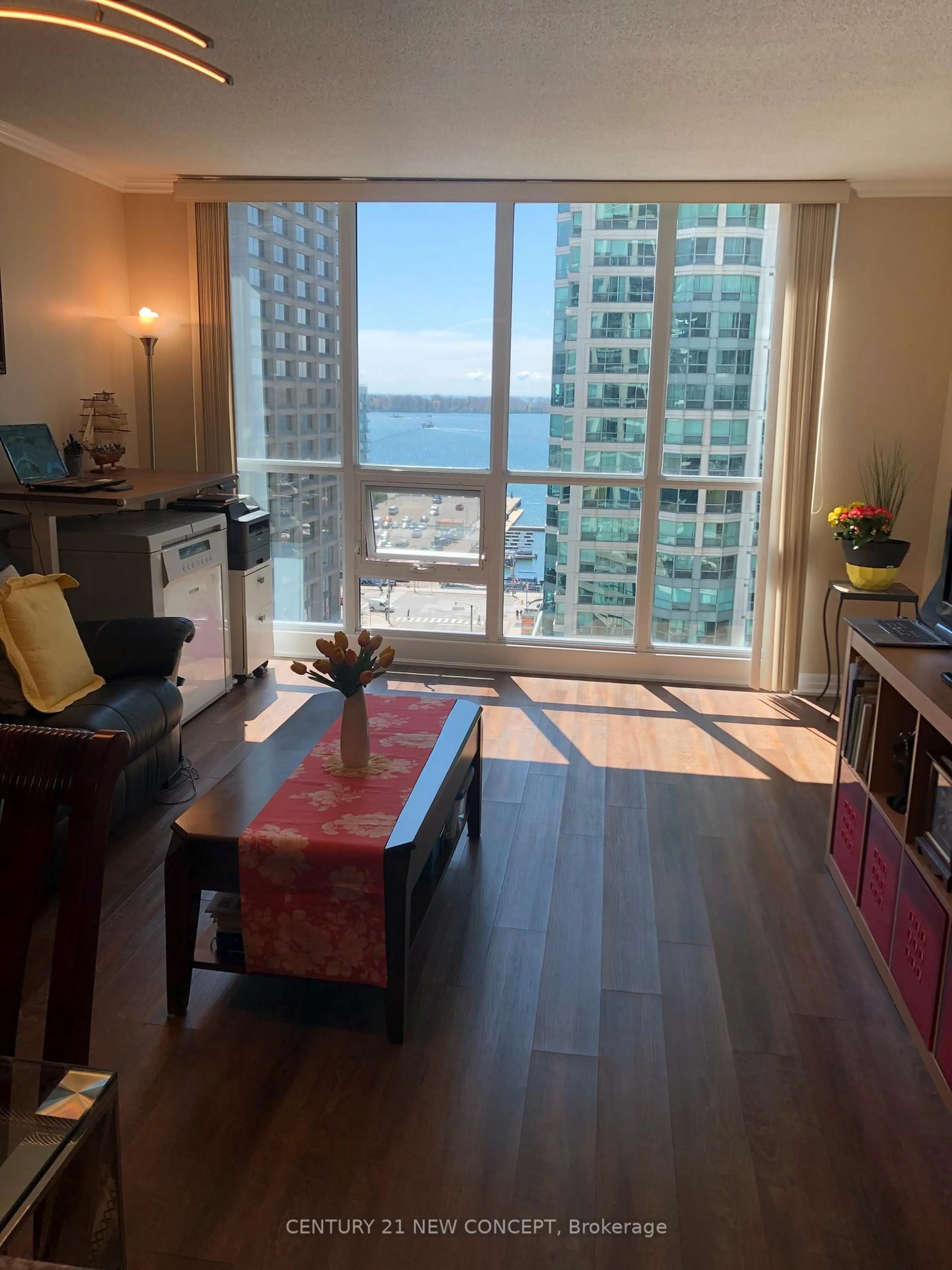 Living room with furniture, wood/laminate floor for 16 Yonge St #1310, Toronto Ontario M5E 2A1
