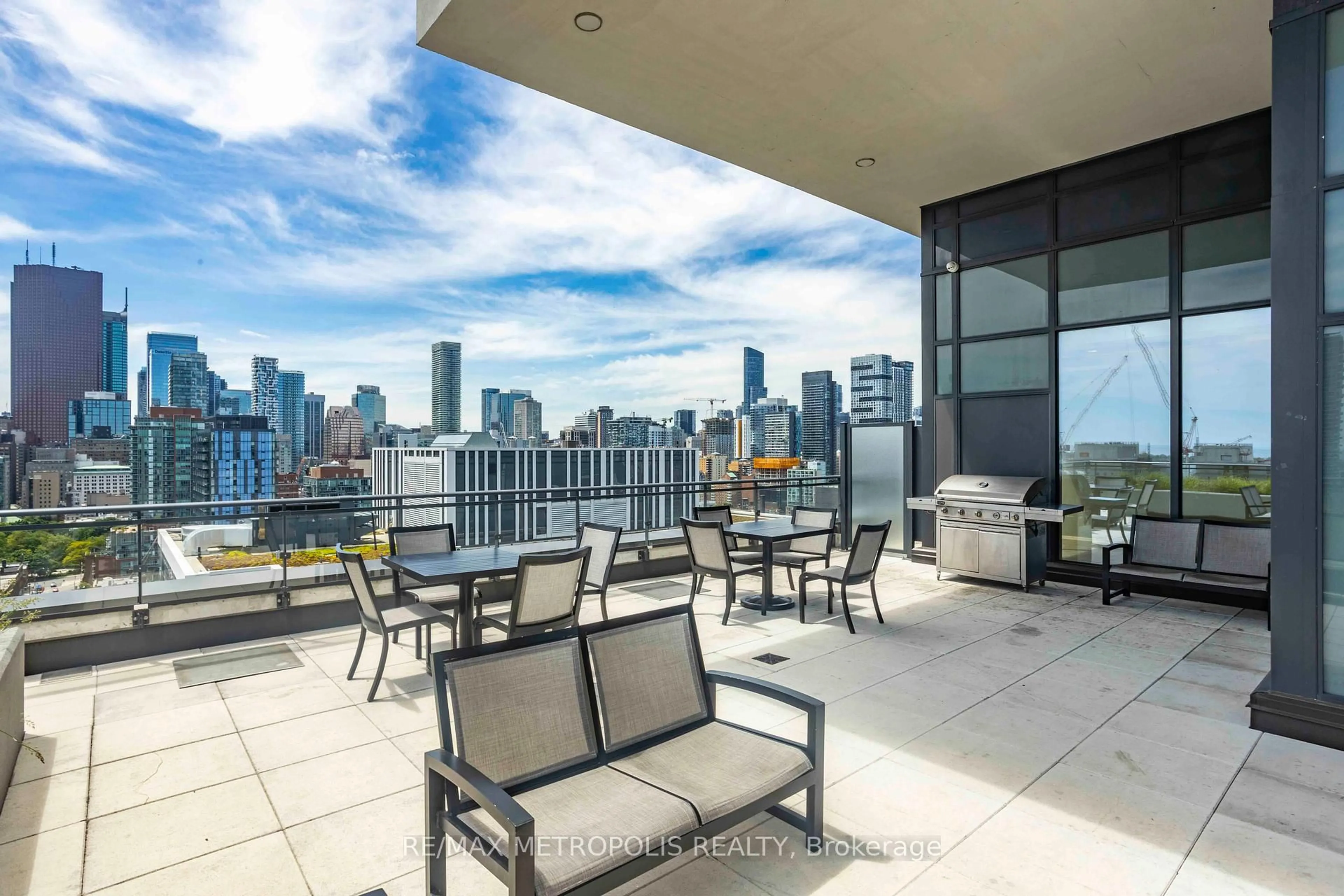 Patio, city buildings view from balcony for 460 Adelaide St #1606, Toronto Ontario M5A 0E7