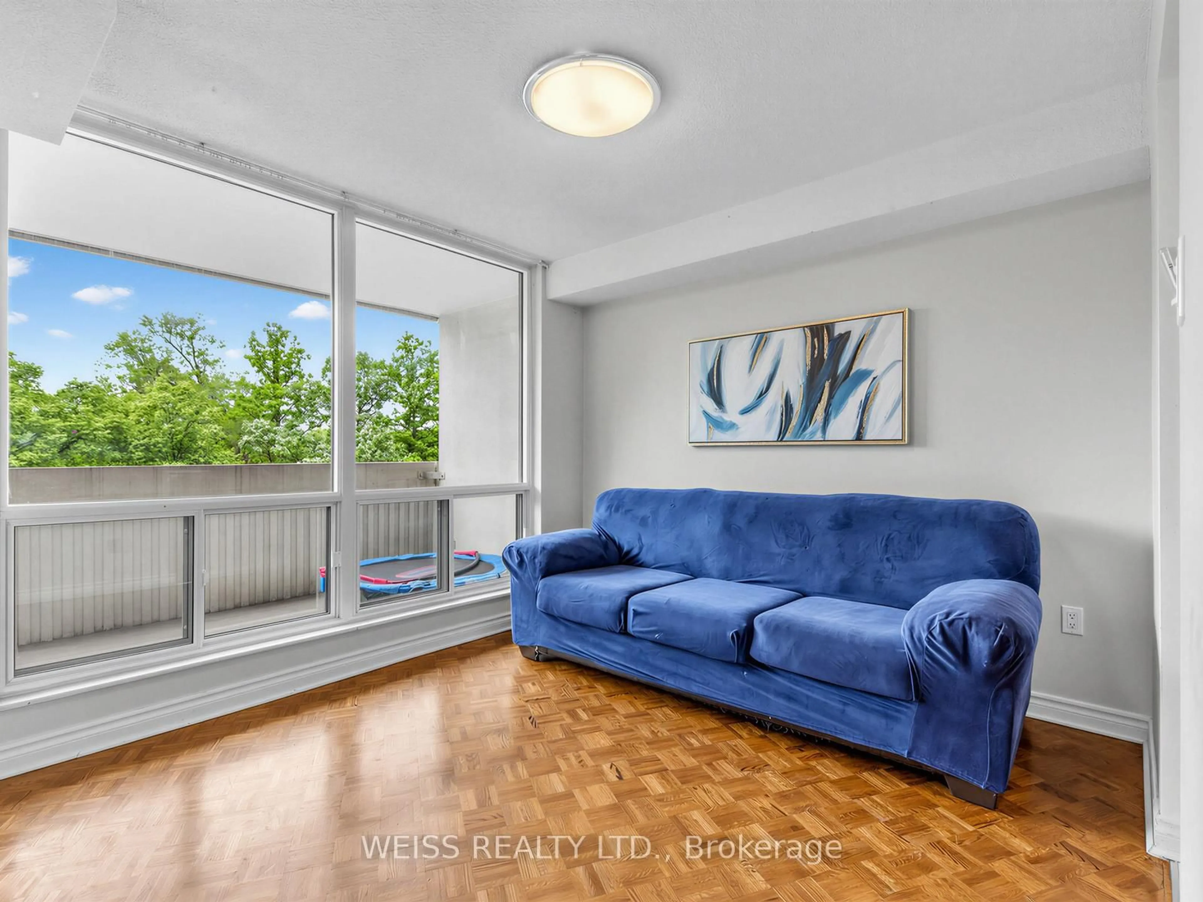 Living room with furniture, unknown for 150 Neptune Dr #202, Toronto Ontario M6A 2Y9