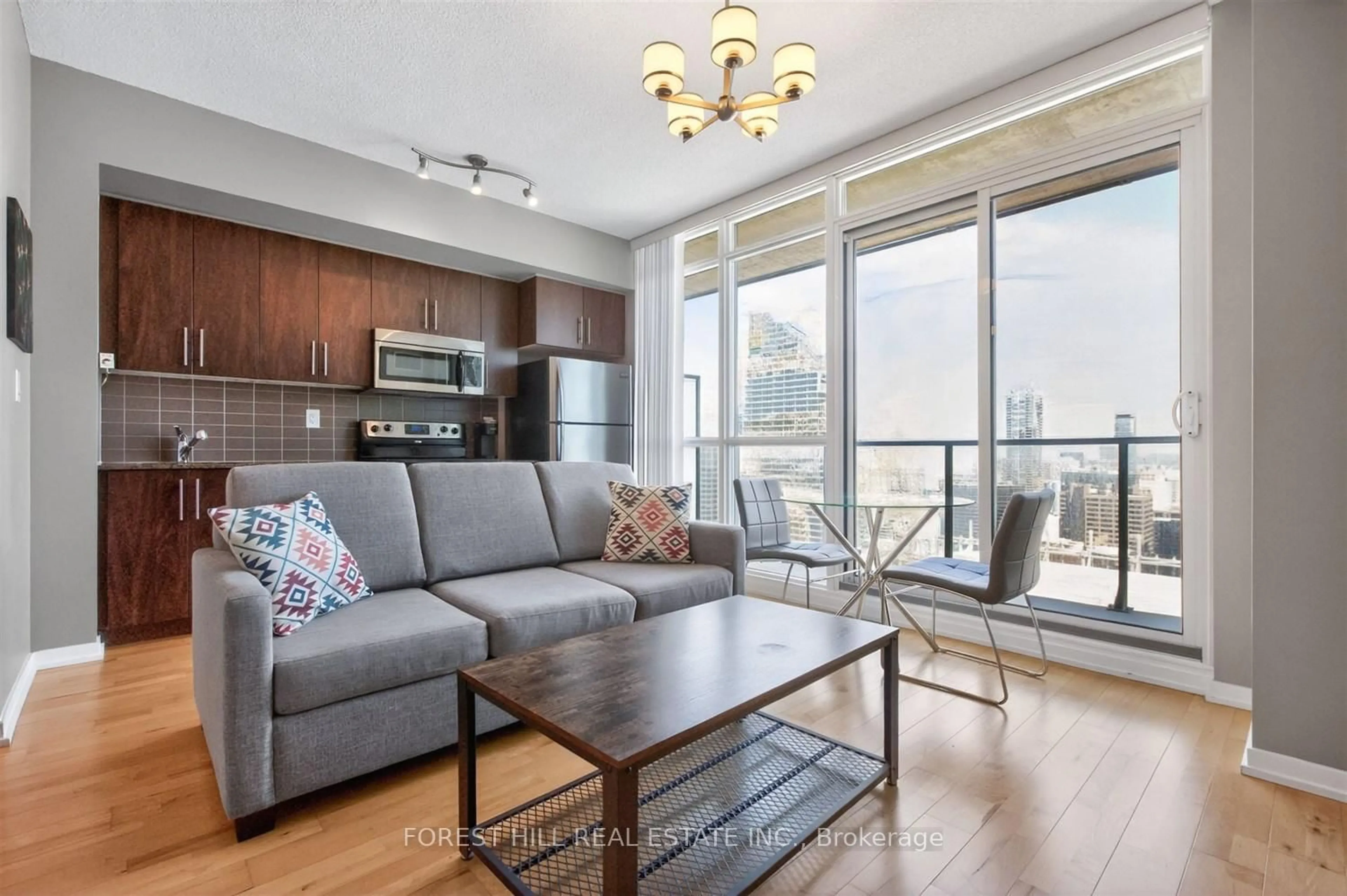 Living room with furniture, wood/laminate floor for 65 Bremner Blvd #4607, Toronto Ontario M5J 0A7