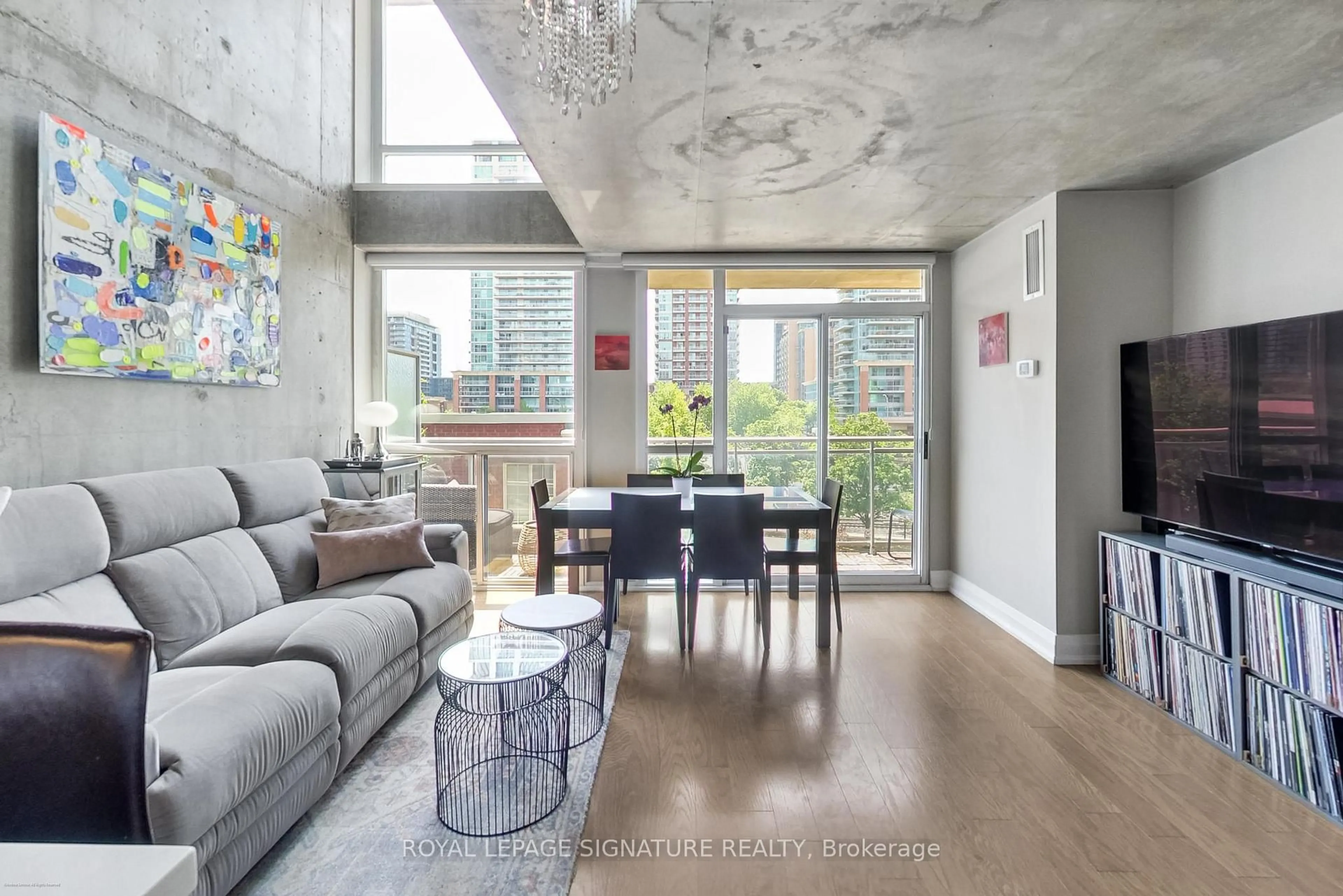 Living room with furniture, cement floor for 1029 King St #443, Toronto Ontario M6K 3M9