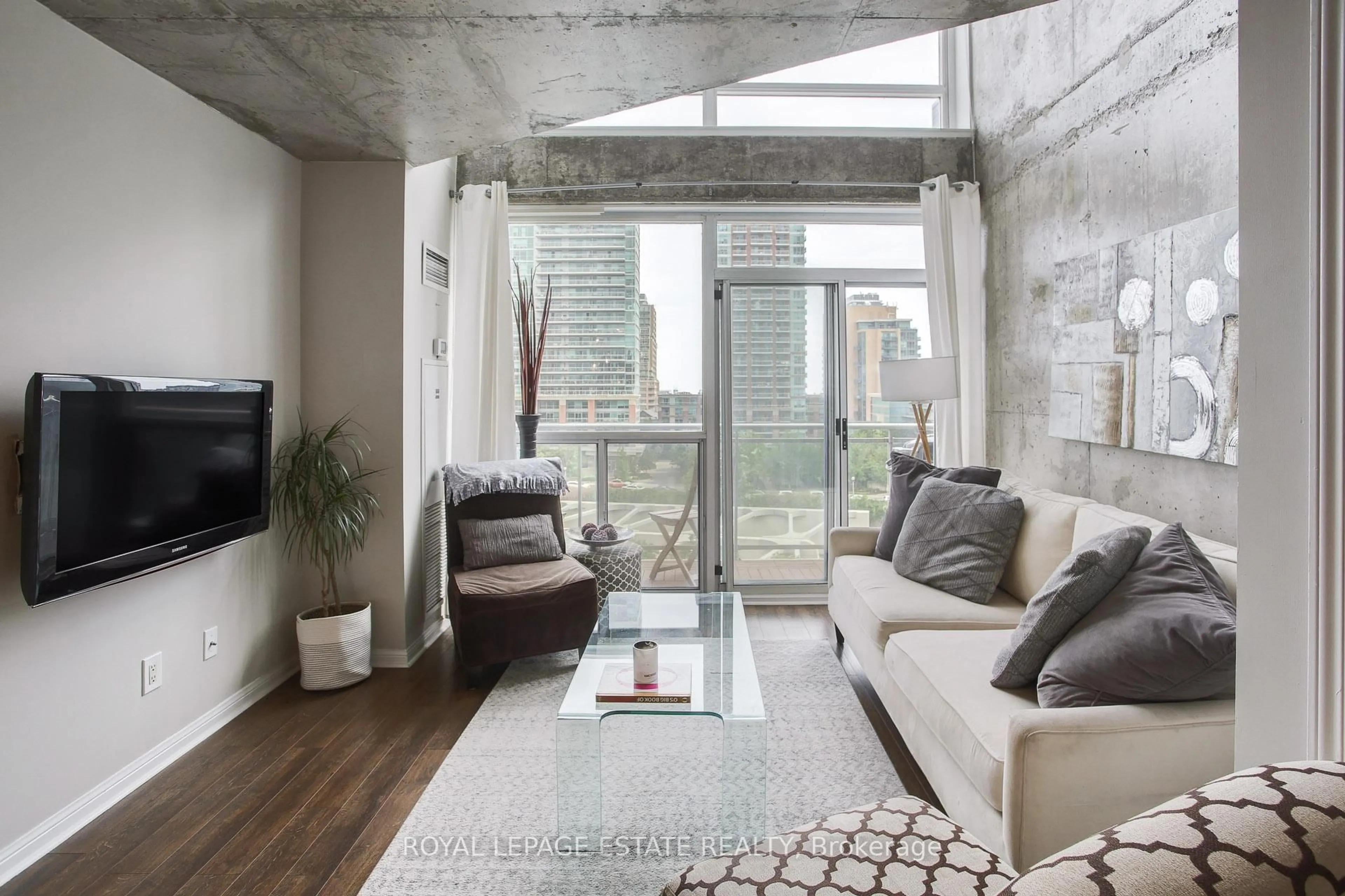 Living room with furniture, cement floor for 1029 King St #837, Toronto Ontario M6K 3M9