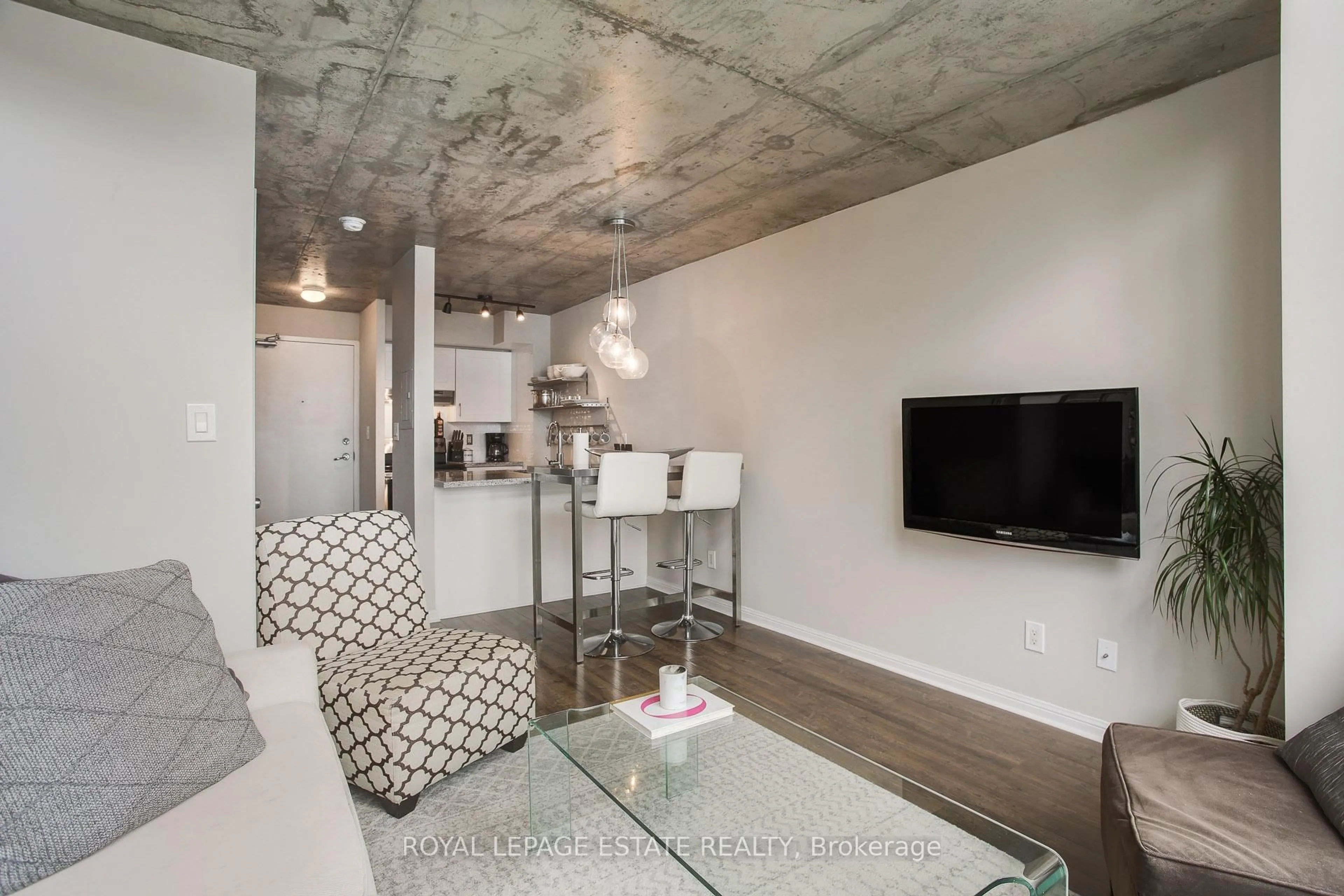 Living room with furniture, cement floor for 1029 King St #837, Toronto Ontario M6K 3M9