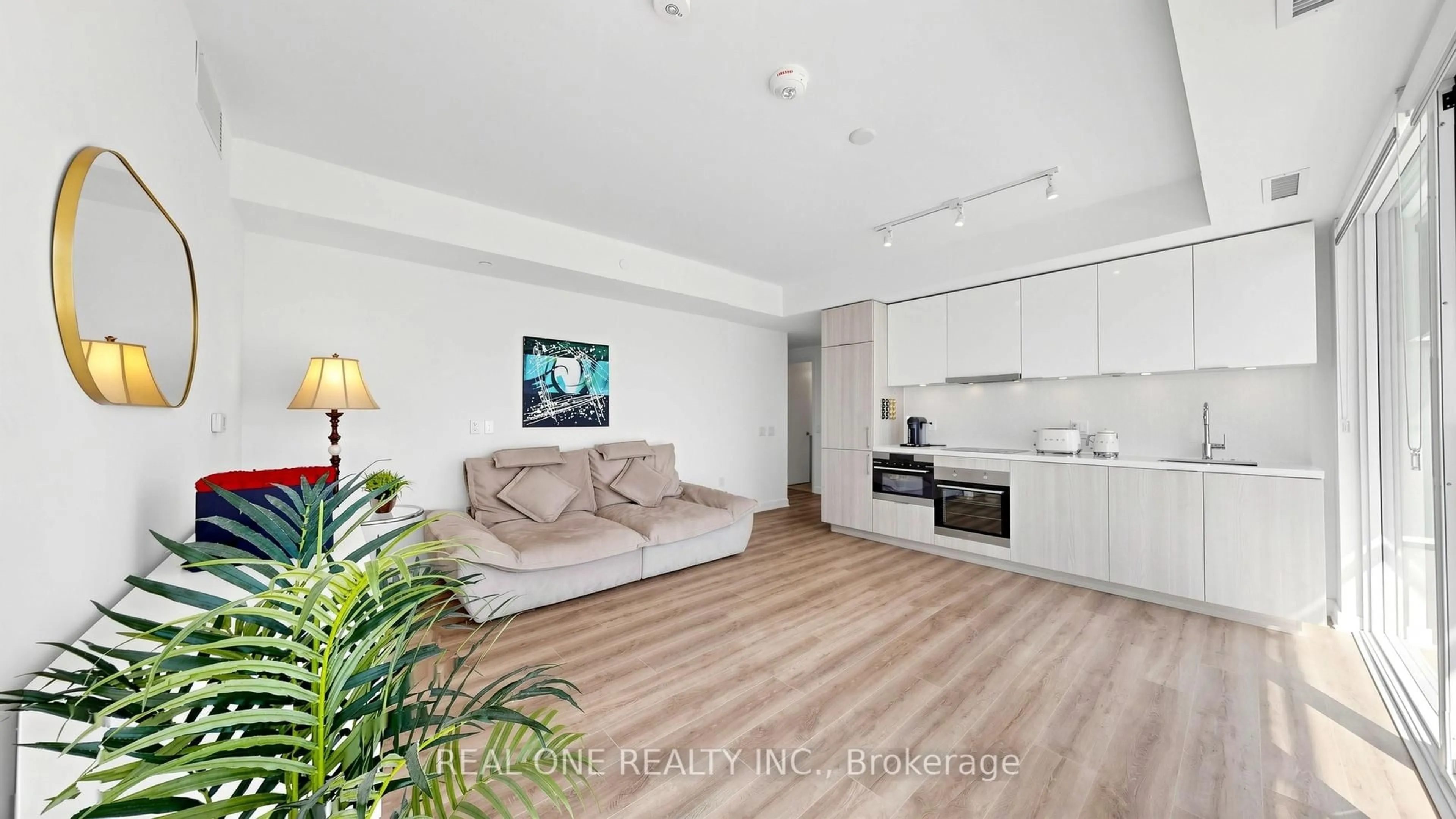 Living room with furniture, wood/laminate floor for 15 Queens Quay #907, Toronto Ontario M5E 0C5