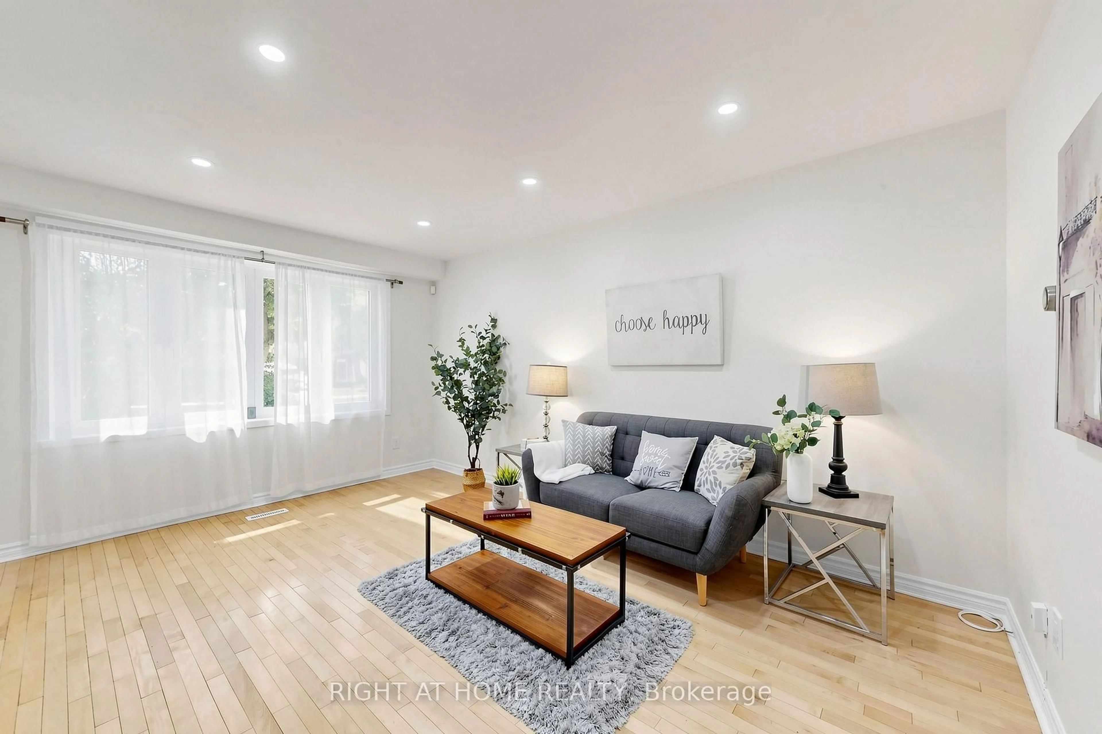 Living room with furniture, wood/laminate floor for 337 Hollyberry Tr, Toronto Ontario M2H 2P5