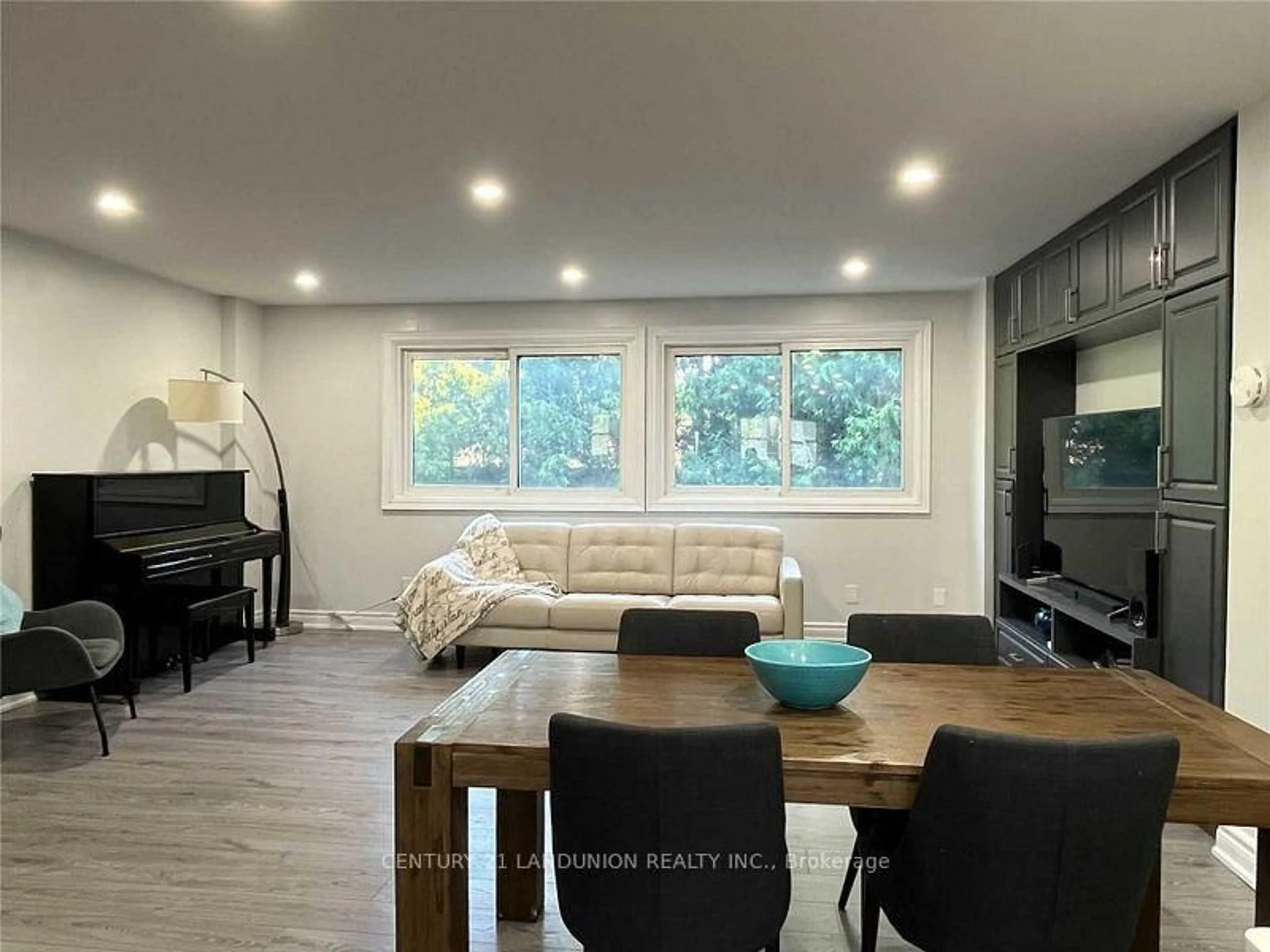 Living room with furniture, wood/laminate floor for 70 Purple Sageway Way, Toronto Ontario M2H 2Z7