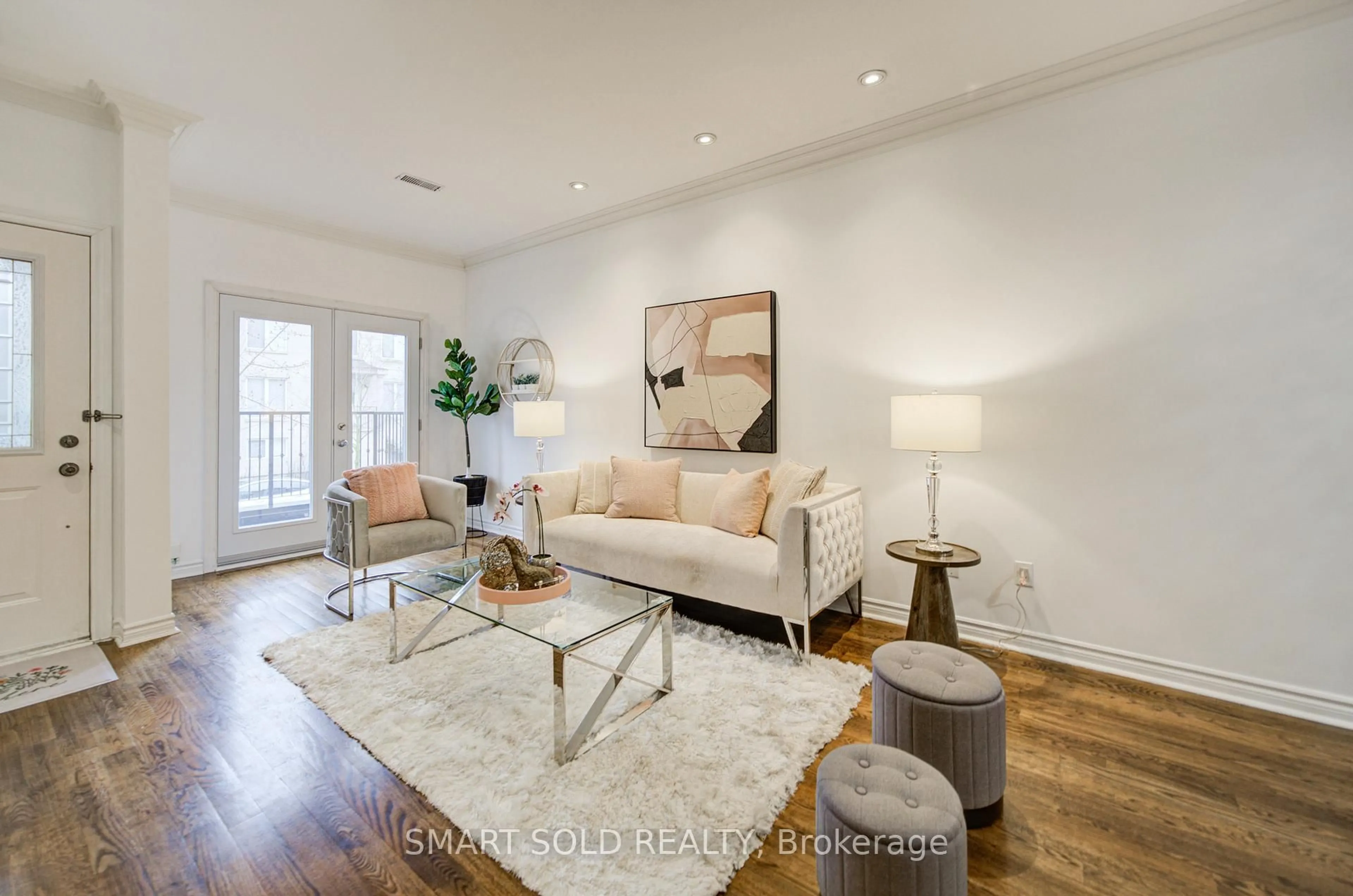 Living room with furniture, wood/laminate floor for 11 Humphrey Gate, Toronto Ontario M3C 4B8