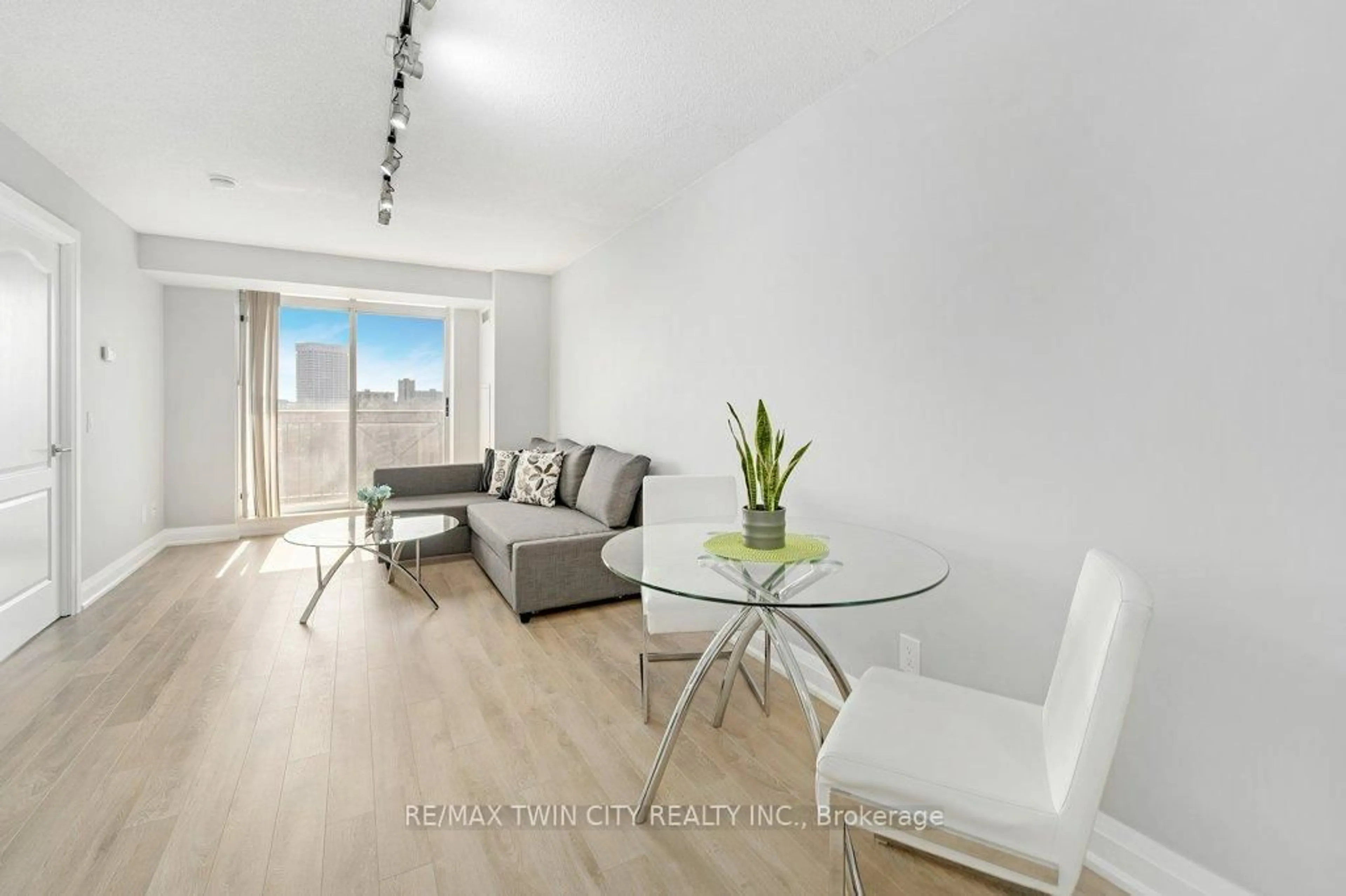 Living room with furniture, wood/laminate floor for 1103 Leslie St #701, Toronto Ontario M3C 4G8