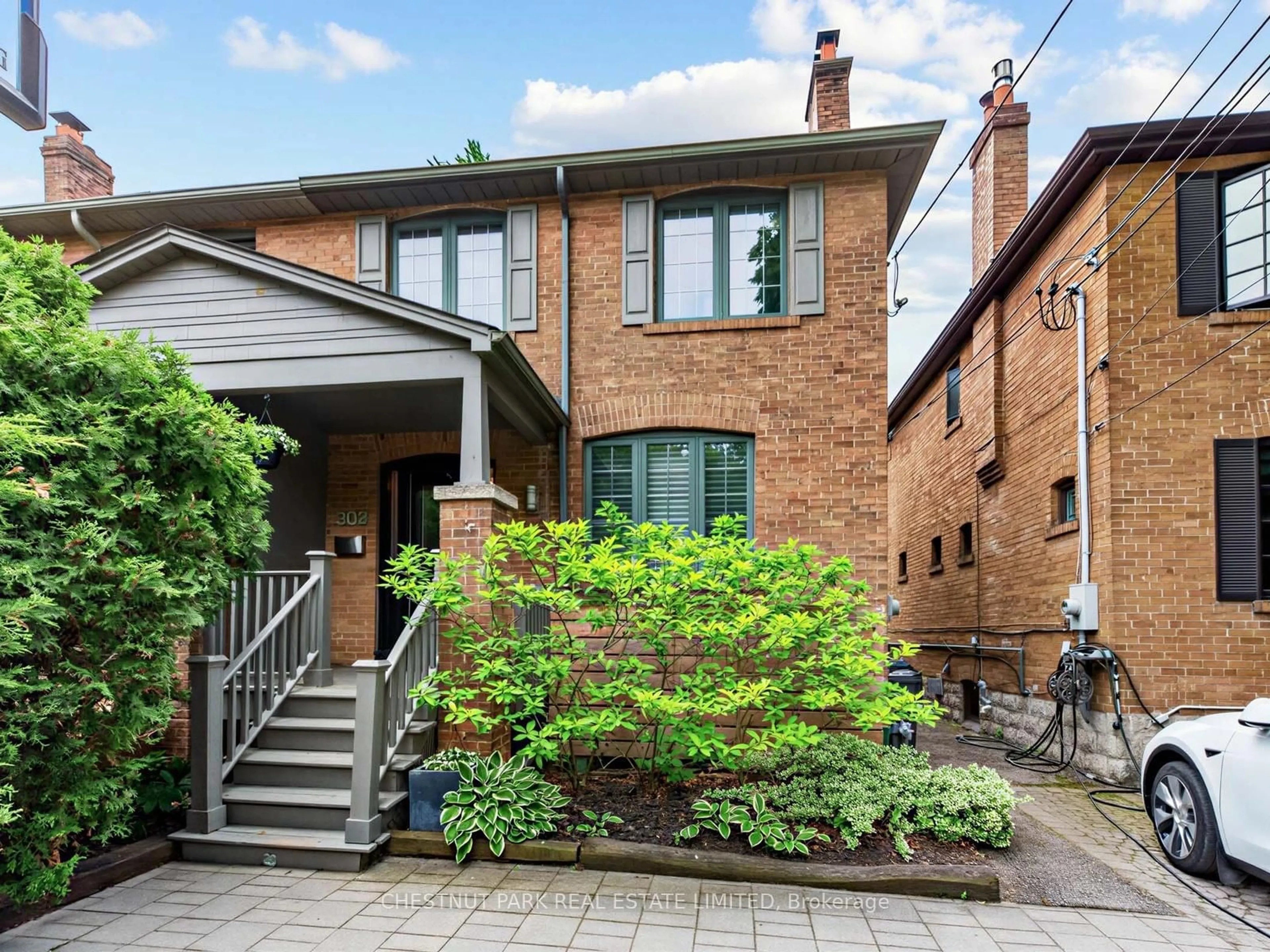 Home with brick exterior material, street for 303 Belsize Dr, Toronto Ontario M4S 1M7