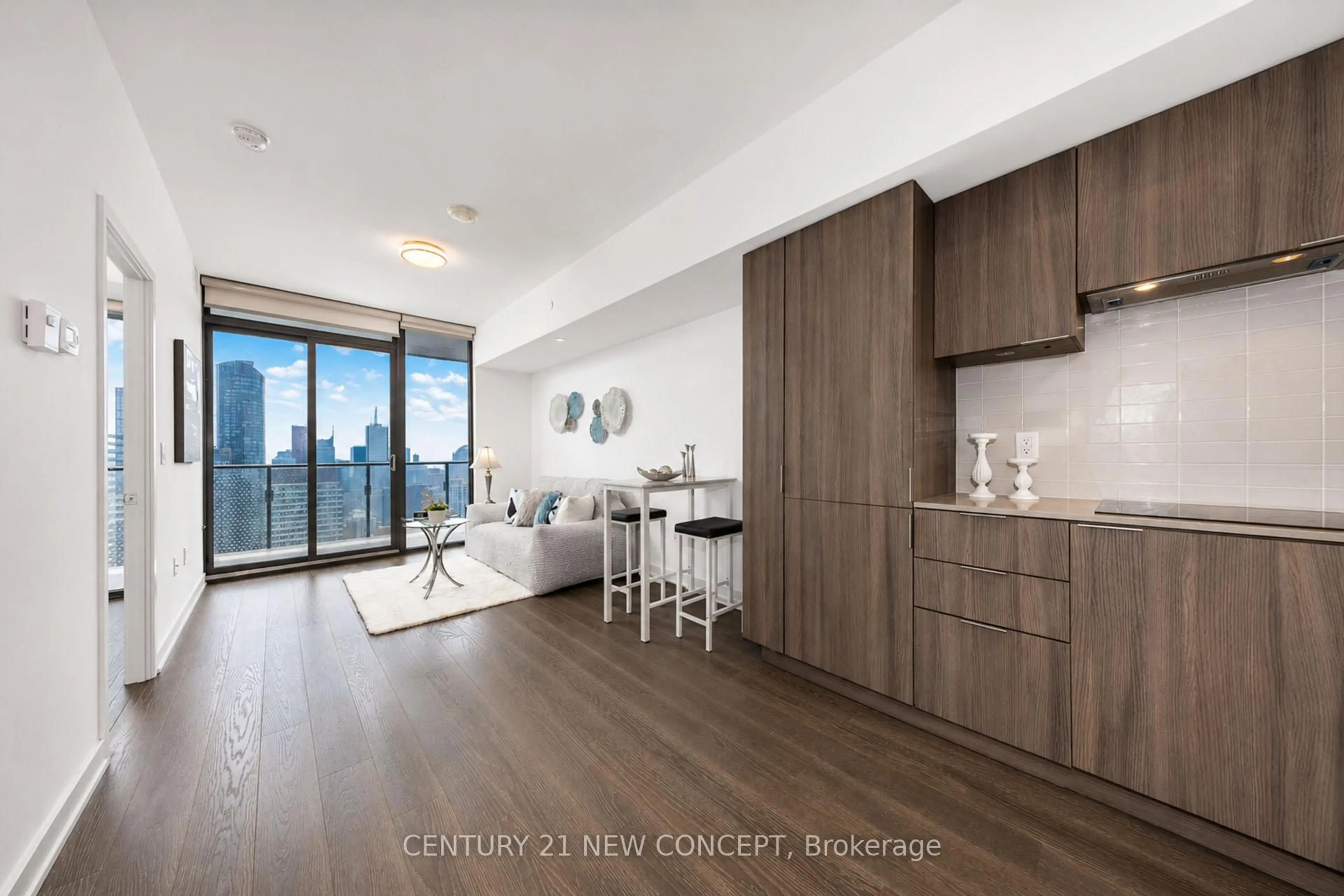 Open concept kitchen, wood/laminate floor for 11 Wellesley St #5503, Toronto Ontario M4Y 0G4