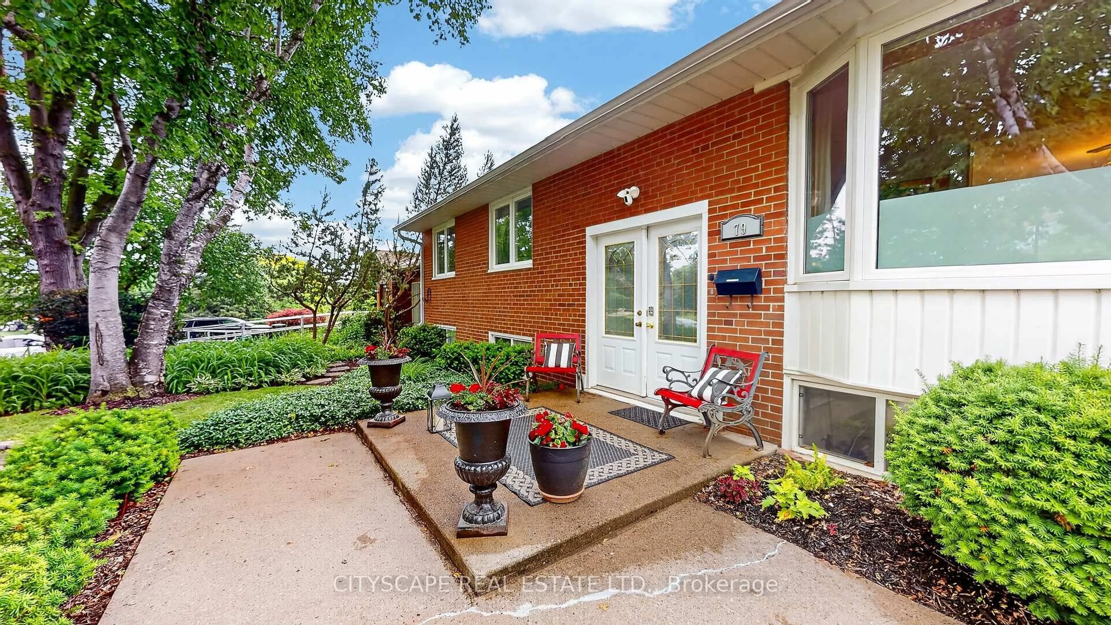 Home with brick exterior material, street for 79 Paperbirch Dr, Toronto Ontario M3C 2E6
