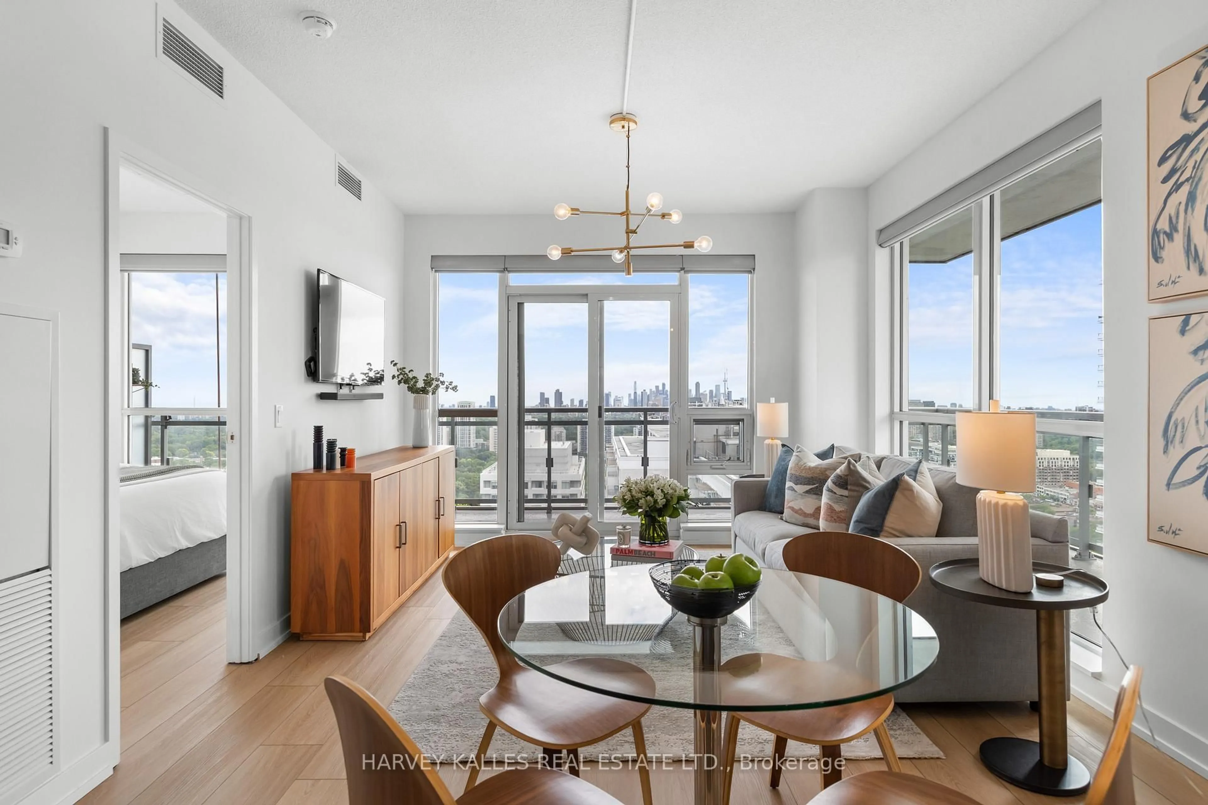 Living room with furniture, wood/laminate floor for 98 Lillian St #2820, Toronto Ontario M4S 0A5